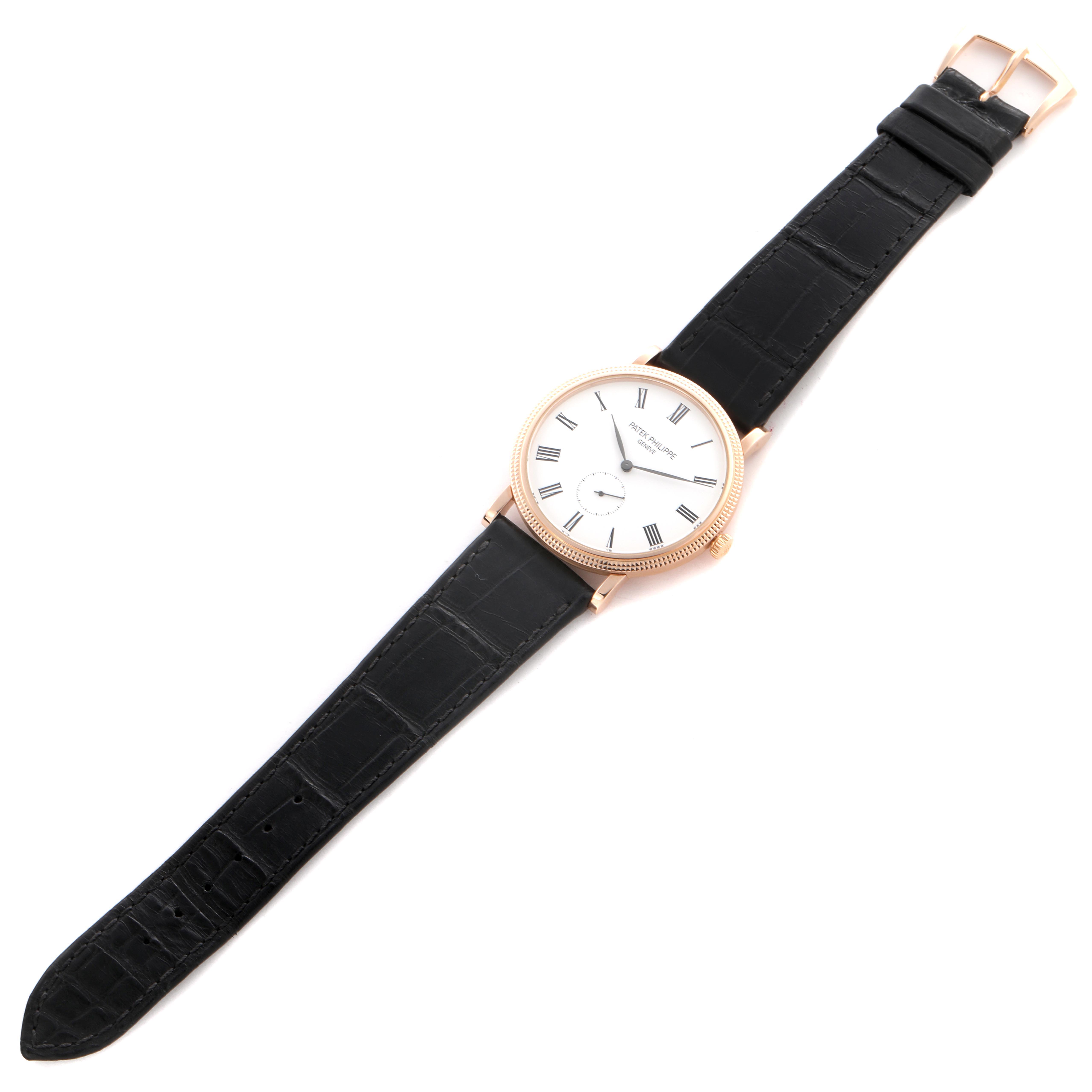 The Patek Philippe Calatrava 5119R Men's Rose Gold White Dial 5119R Men's Rose Gold White Dial watch is shown face-up, displaying the dial, hands, and leather strap.