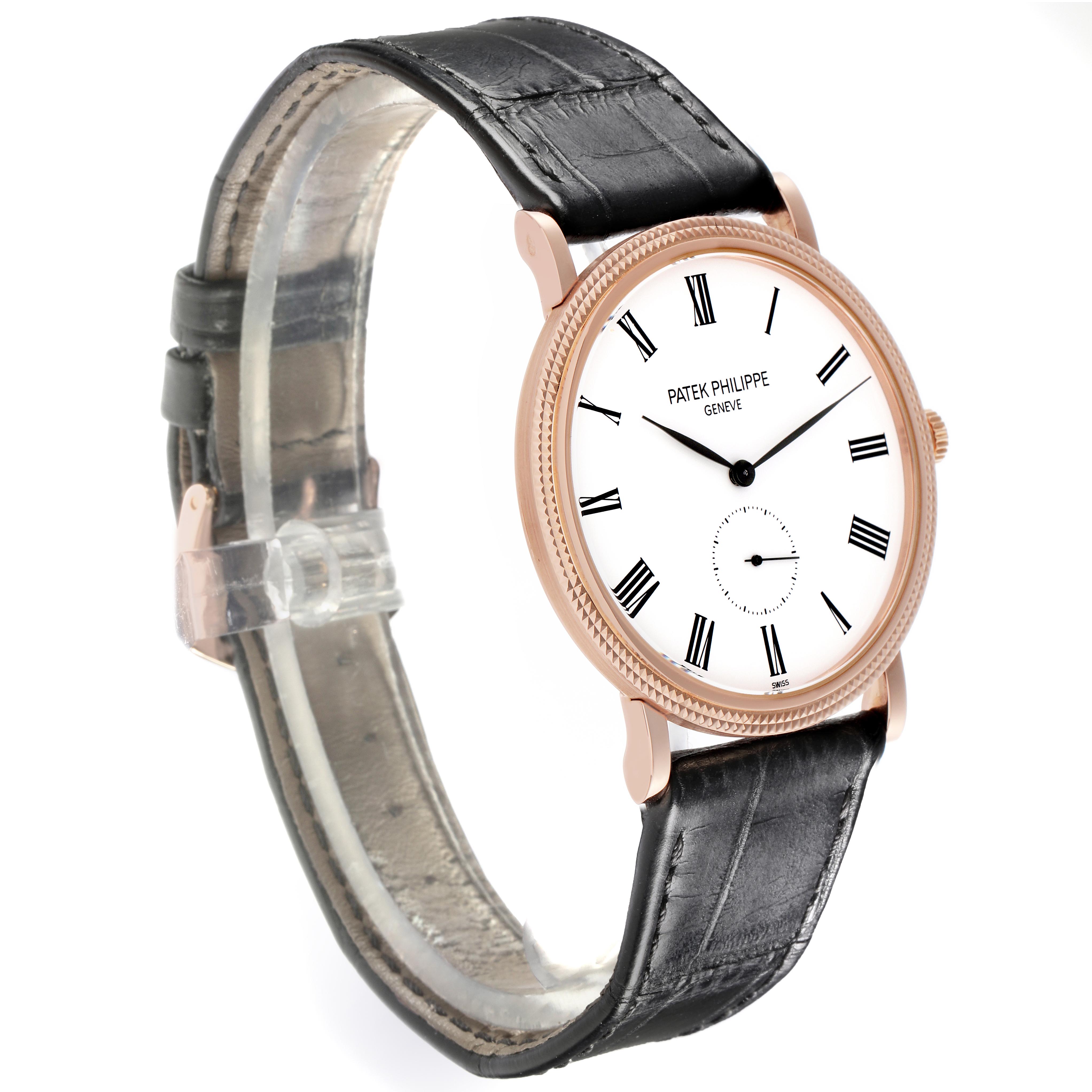 The image shows a Patek Philippe Calatrava 5119R Men's Rose Gold White Dial 5119R Men's Rose Gold White Dial watch from a front-side angle, highlighting its dial, bezel, and leather strap.