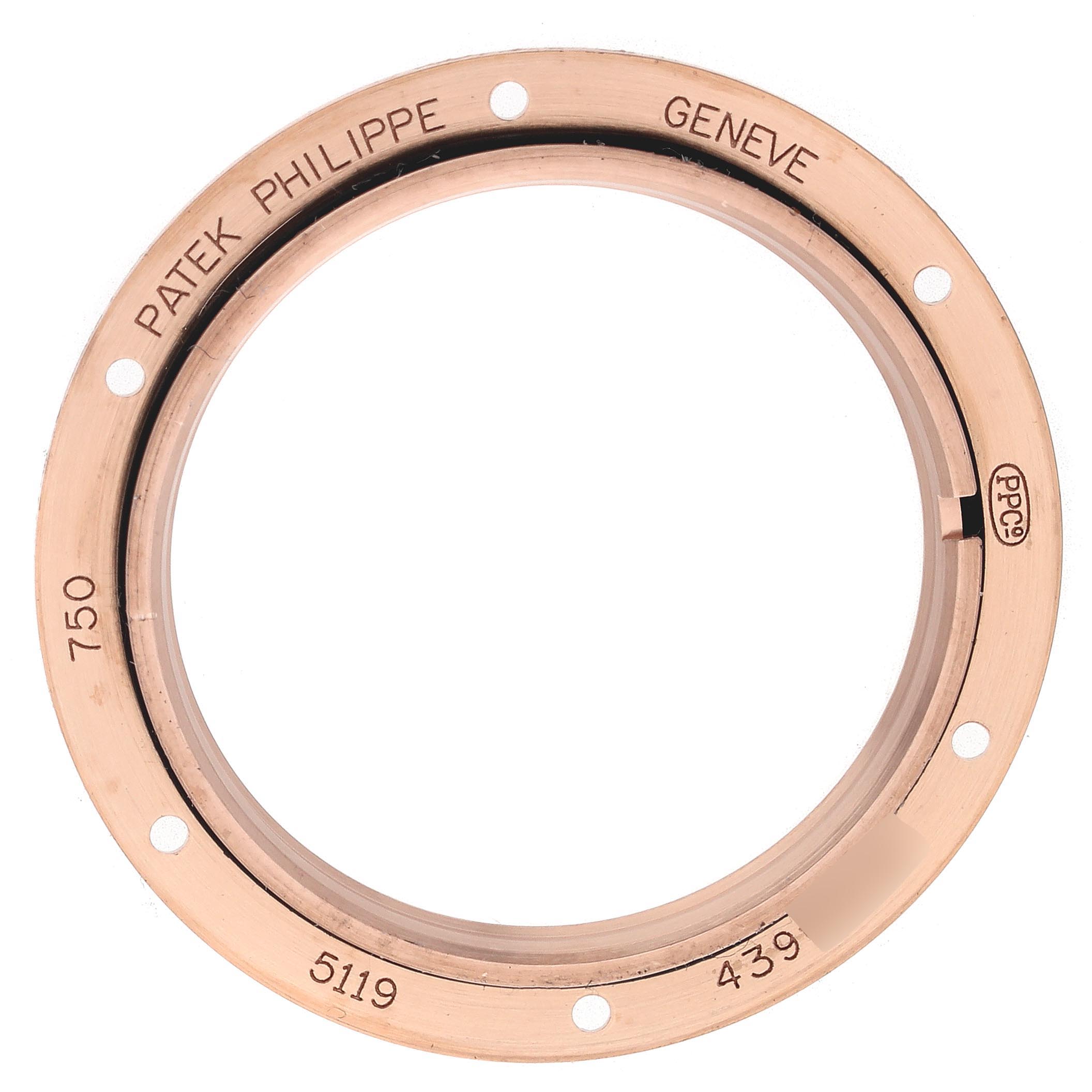 This image shows the case back ring of a Patek Philippe Calatrava 5119R Men's Rose Gold White Dial 5119R Men's Rose Gold White Dial watch, featuring engraved text and screw holes.