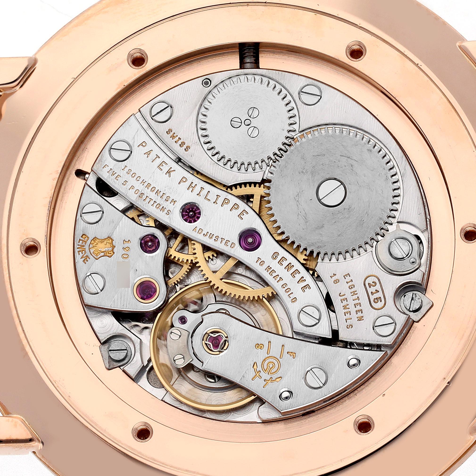 The image shows the rear view of a Patek Philippe Calatrava 5119R Men's Rose Gold White Dial 5119R Men's Rose Gold White Dial watch movement, highlighting gears and intricate mechanics.