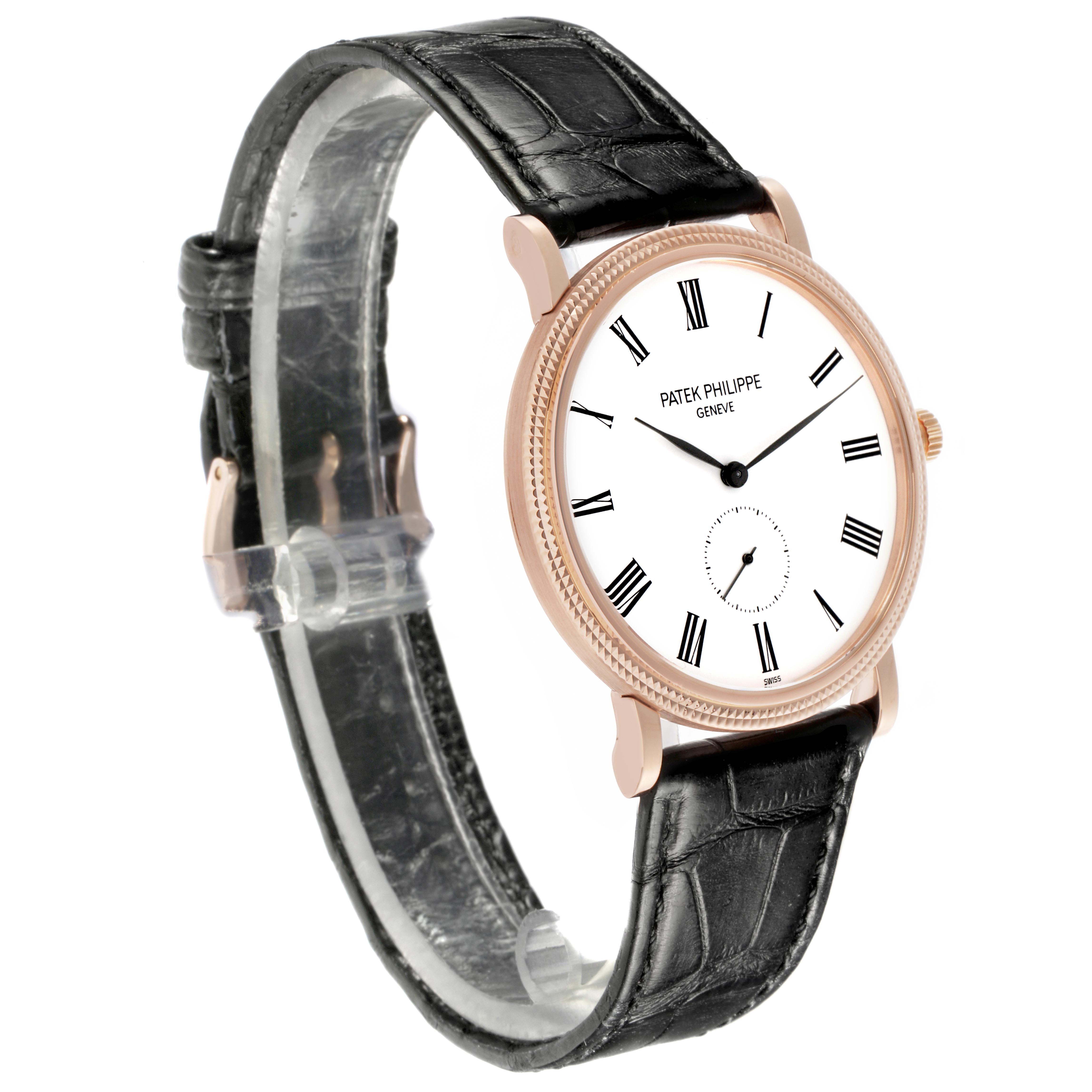 The Patek Philippe Calatrava 5119R Men's Rose Gold White Dial 5119R Men's Rose Gold White Dial watch is shown at a three-quarter angle, displaying the face, bezel, and black leather strap.