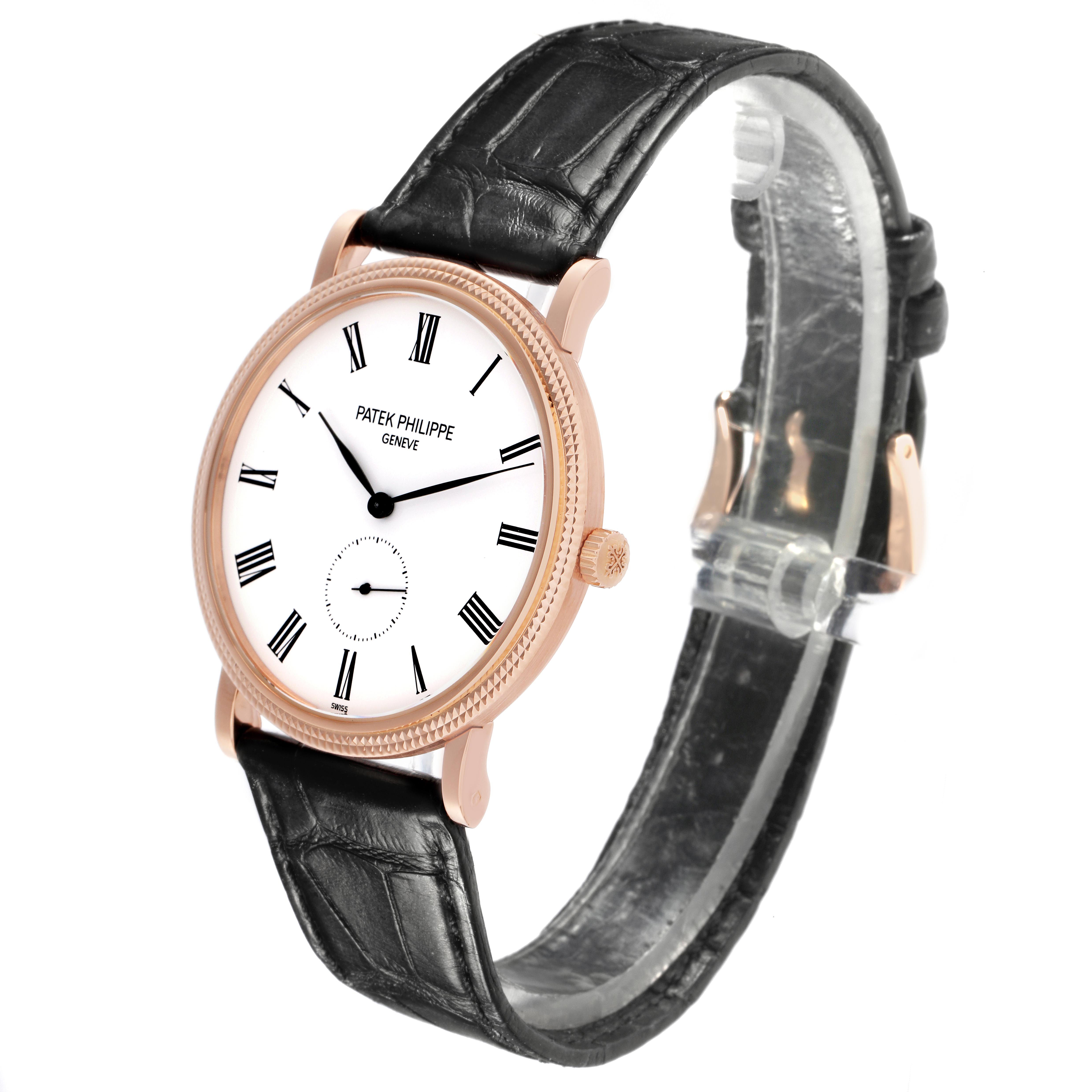 The Patek Philippe Calatrava 5119R Men's Rose Gold White Dial 5119R Men's Rose Gold White Dial watch is shown at a three-quarter angle, highlighting the dial, rose gold case, and black leather strap.