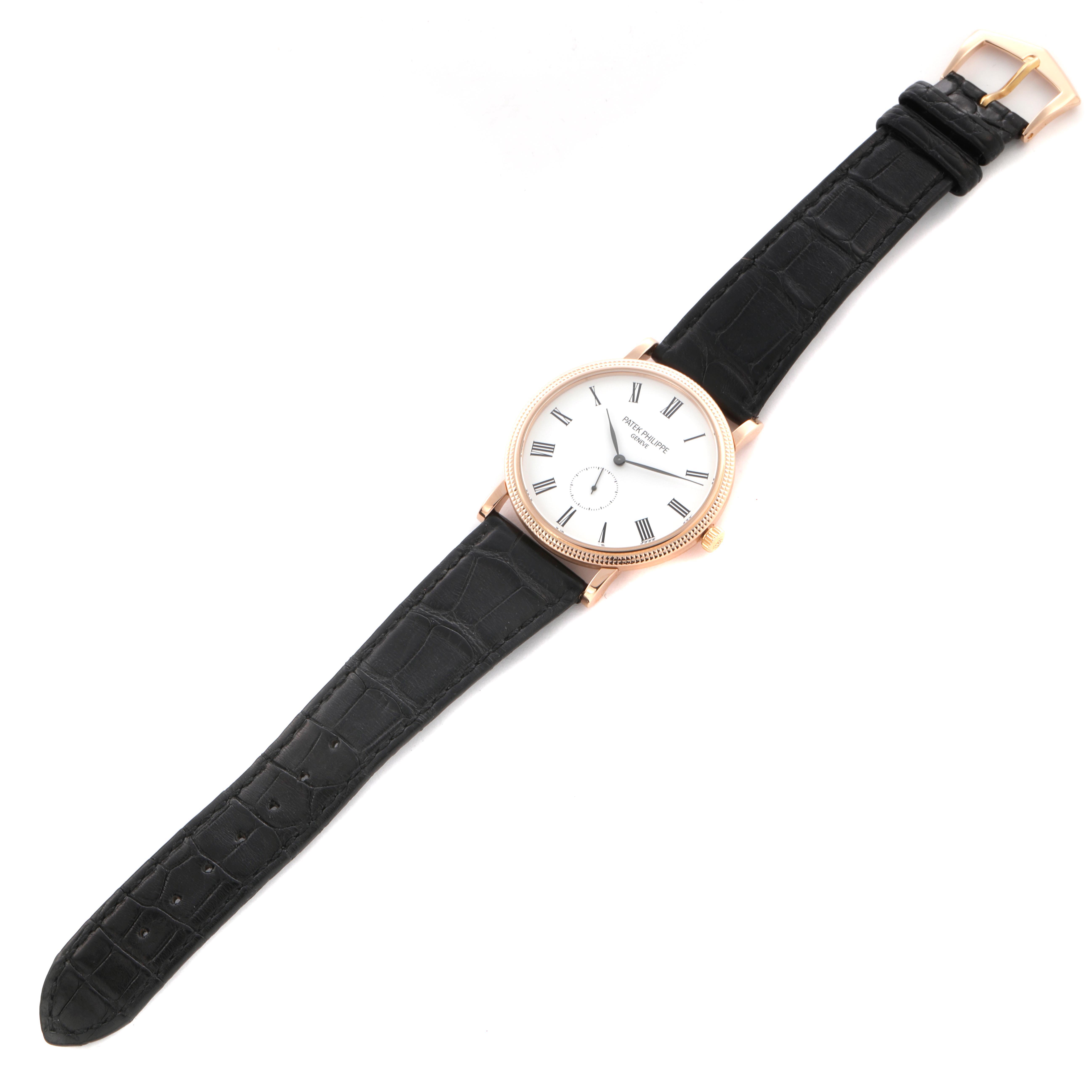The Patek Philippe Calatrava 5119R Men's Rose Gold White Dial 5119R Men's Rose Gold White Dial watch is shown in a top-down view displaying the face, case, strap, and buckle.