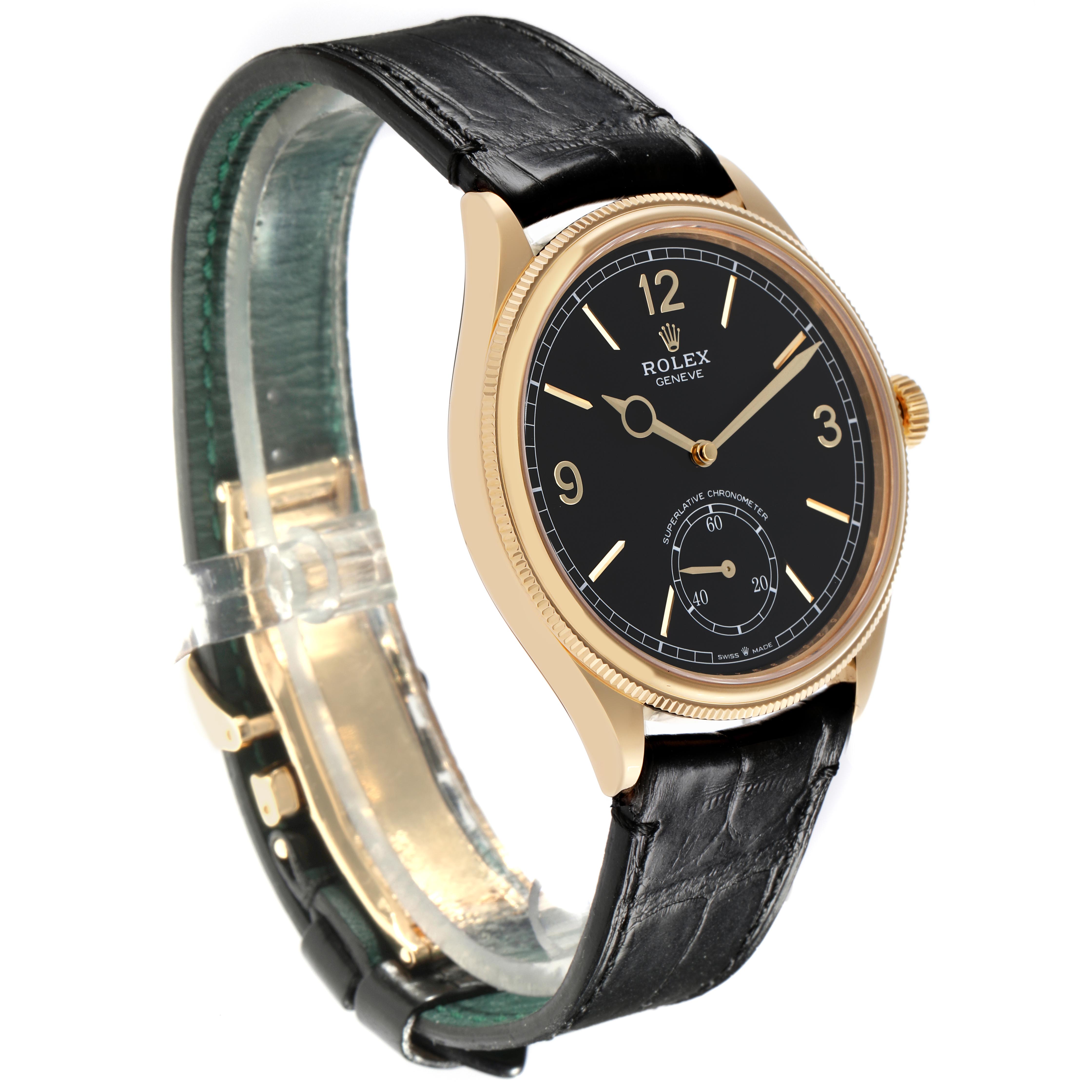 The Rolex 1908 52508-0002 Men
s Yellow Gold Black Dial 52508-0002 Men
s Yellow Gold Black Dial watch is shown at a slight angle, displaying the dial, case, crown, and part of the leather strap.