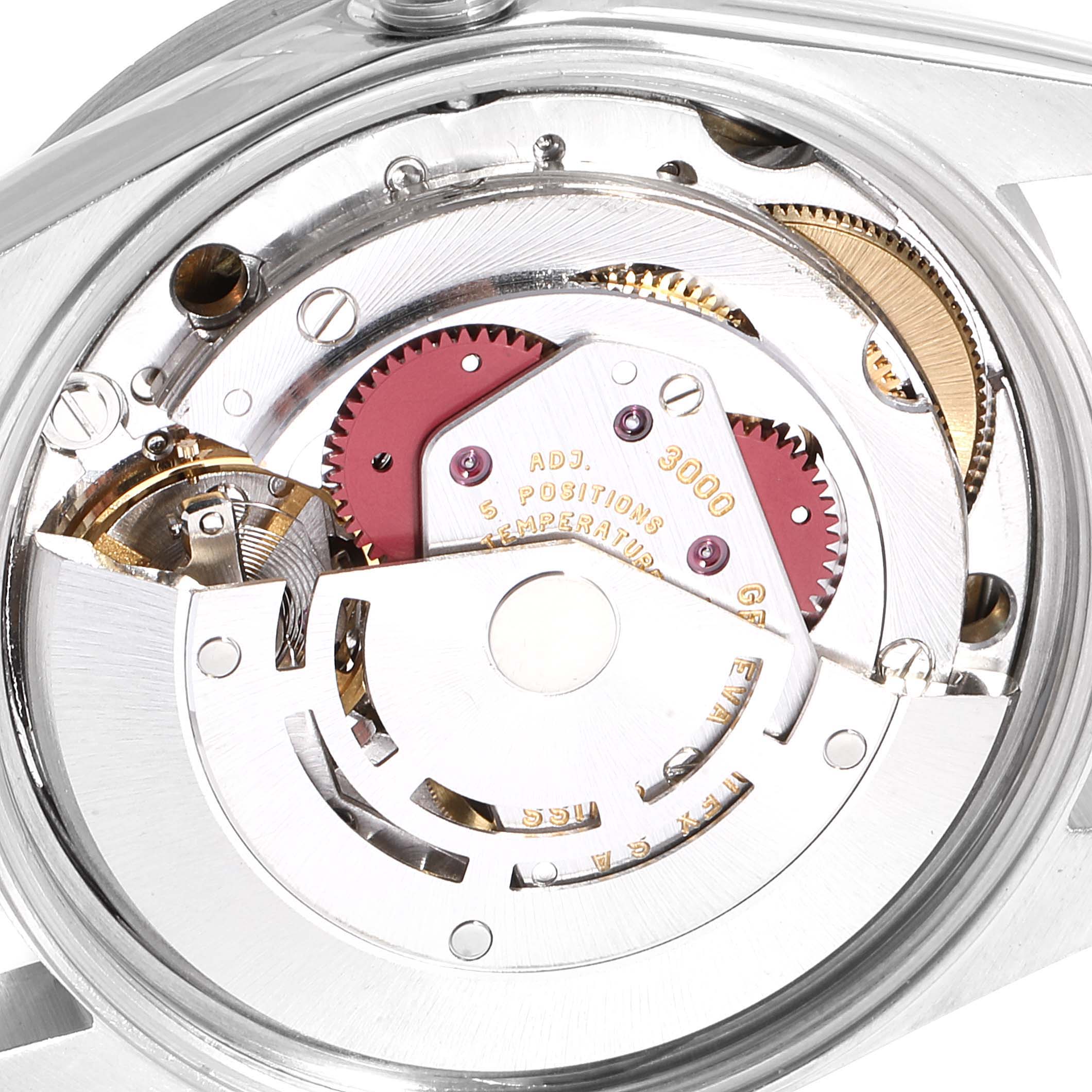 The image shows an internal view of the mechanical movement of the Rolex Air-King 14010 Men's Stainless Steel Blue Dial 14010 Men's Stainless Steel Blue Dial watch, including gears and rotor.