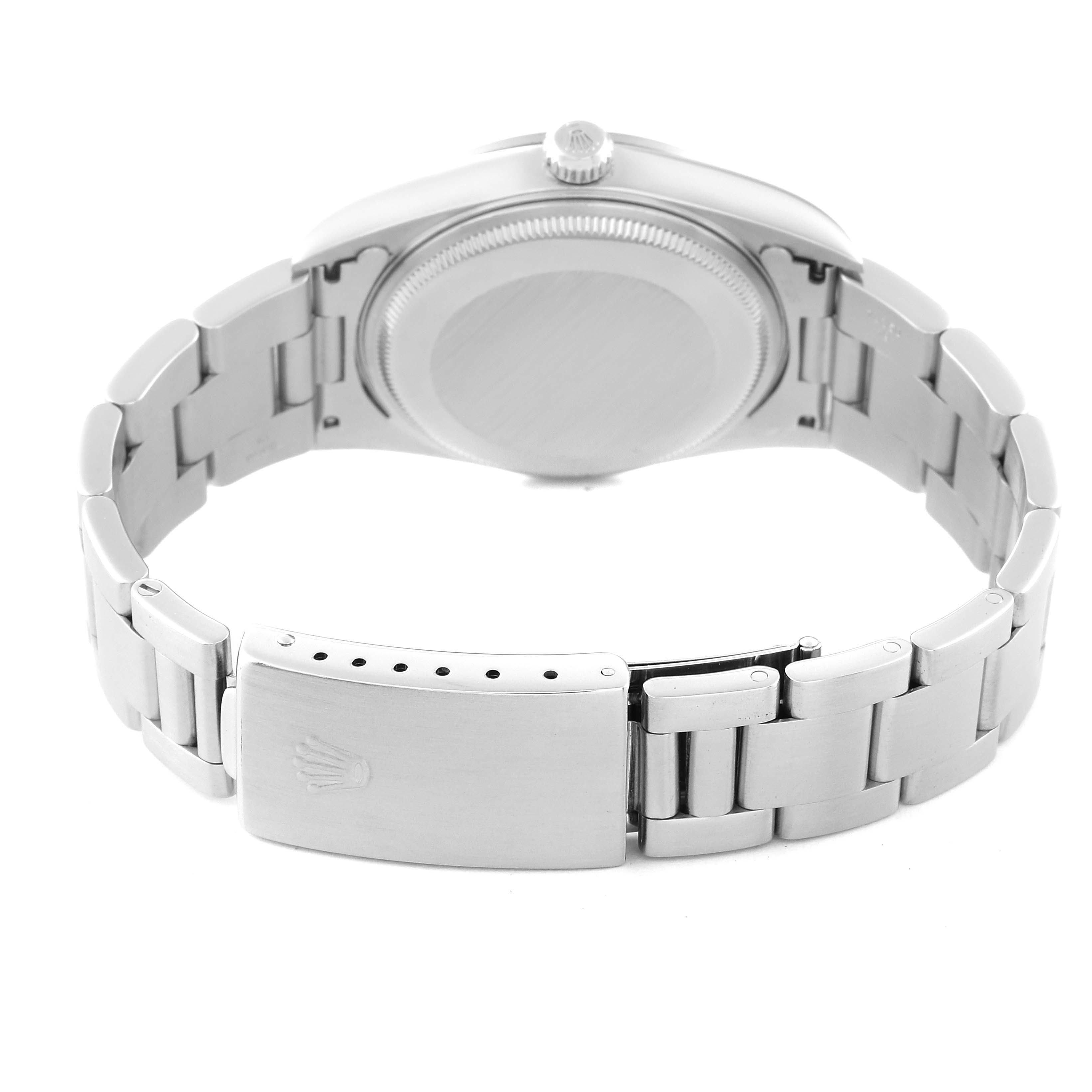 This image shows the back view of a Rolex Air-King 14000 Men's Stainless Steel Pink Dial 14000 Men's Stainless Steel Pink Dial watch, including its bracelet, clasp, and caseback.