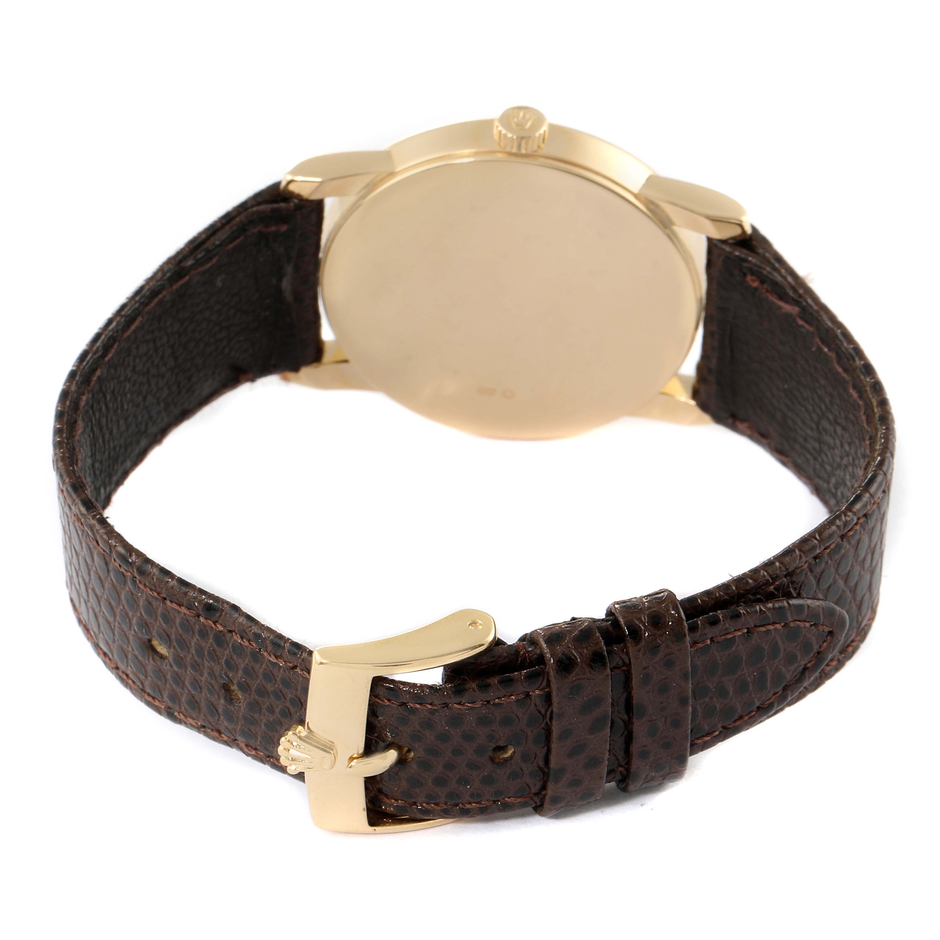 The image shows the back of a Rolex Cellini 5116 Men's Yellow Gold Beige Dial 5116 Men's Yellow Gold Beige Dial watch, highlighting its gold case, crown, and brown leather strap with a gold buckle.