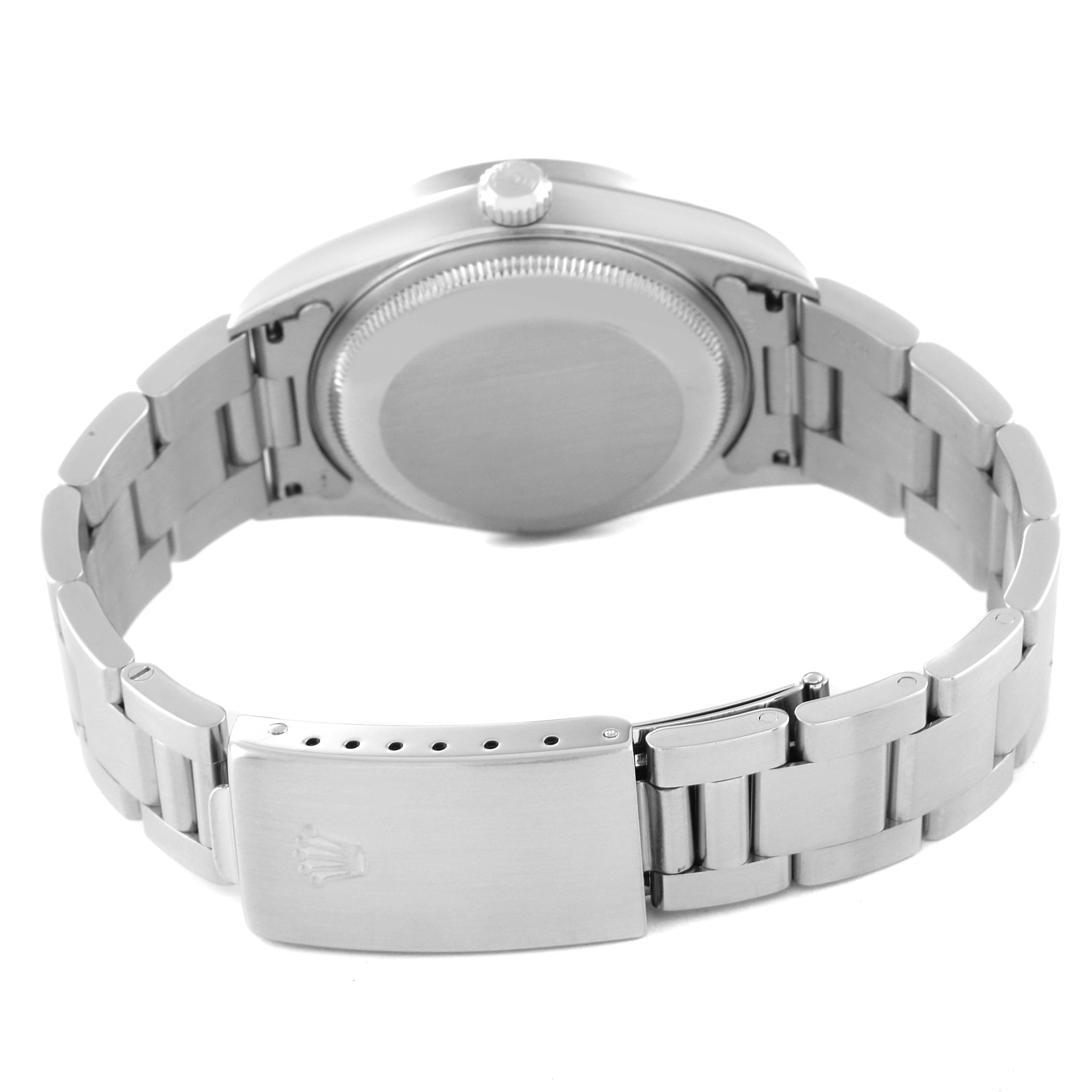 This image shows the back of a Rolex Date 15210 Men's Stainless Steel Black Dial 15210 Men's Stainless Steel Black Dial watch, including its case back, crown, and metal bracelet.