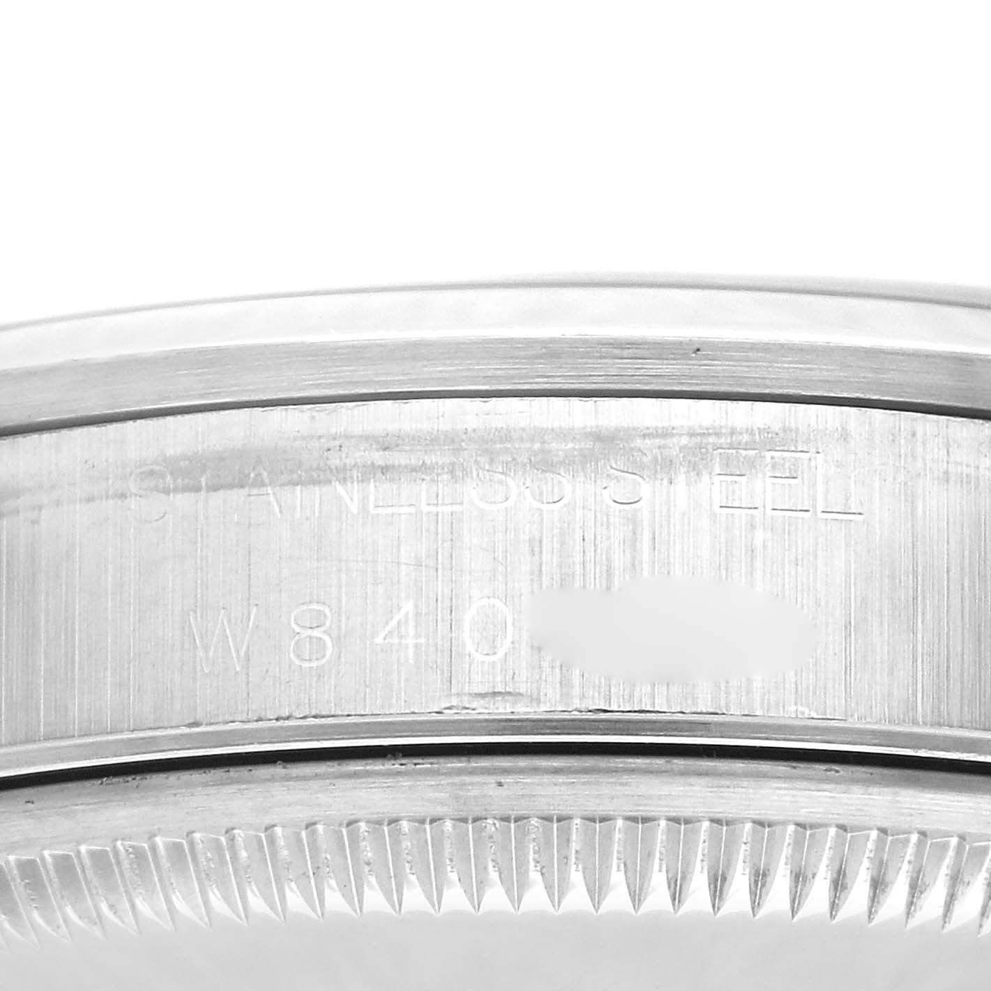 This image shows a close-up of the case back edge and serial number of a Rolex Date 15200 Men
s Stainless Steel Black Dial 15200 Men
s Stainless Steel Black Dial model watch.