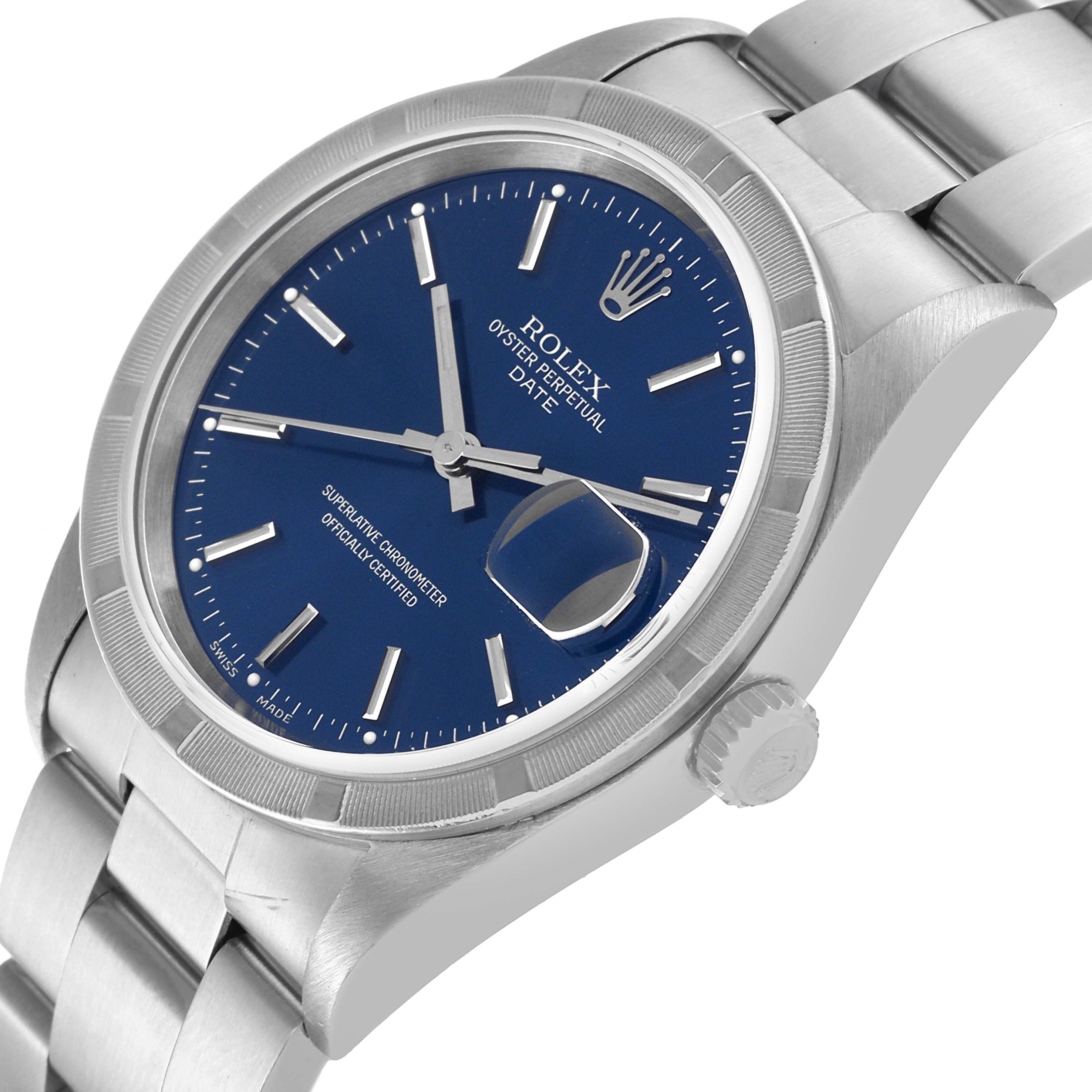 The image shows a Rolex Oyster Perpetual Date watch with a blue dial, bezel, and partial bracelet viewed from an angled perspective.