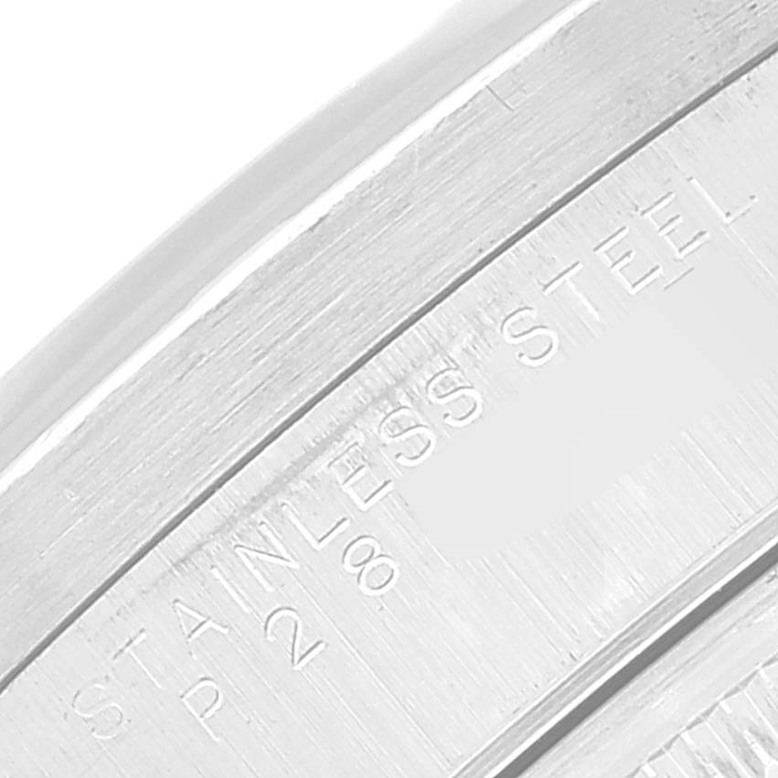 Close-up of the stainless steel inscription on the case side or bezel of a Rolex Date 15210 Men's Stainless Steel Blue Dial 15210 Men's Stainless Steel Blue Dial model watch.