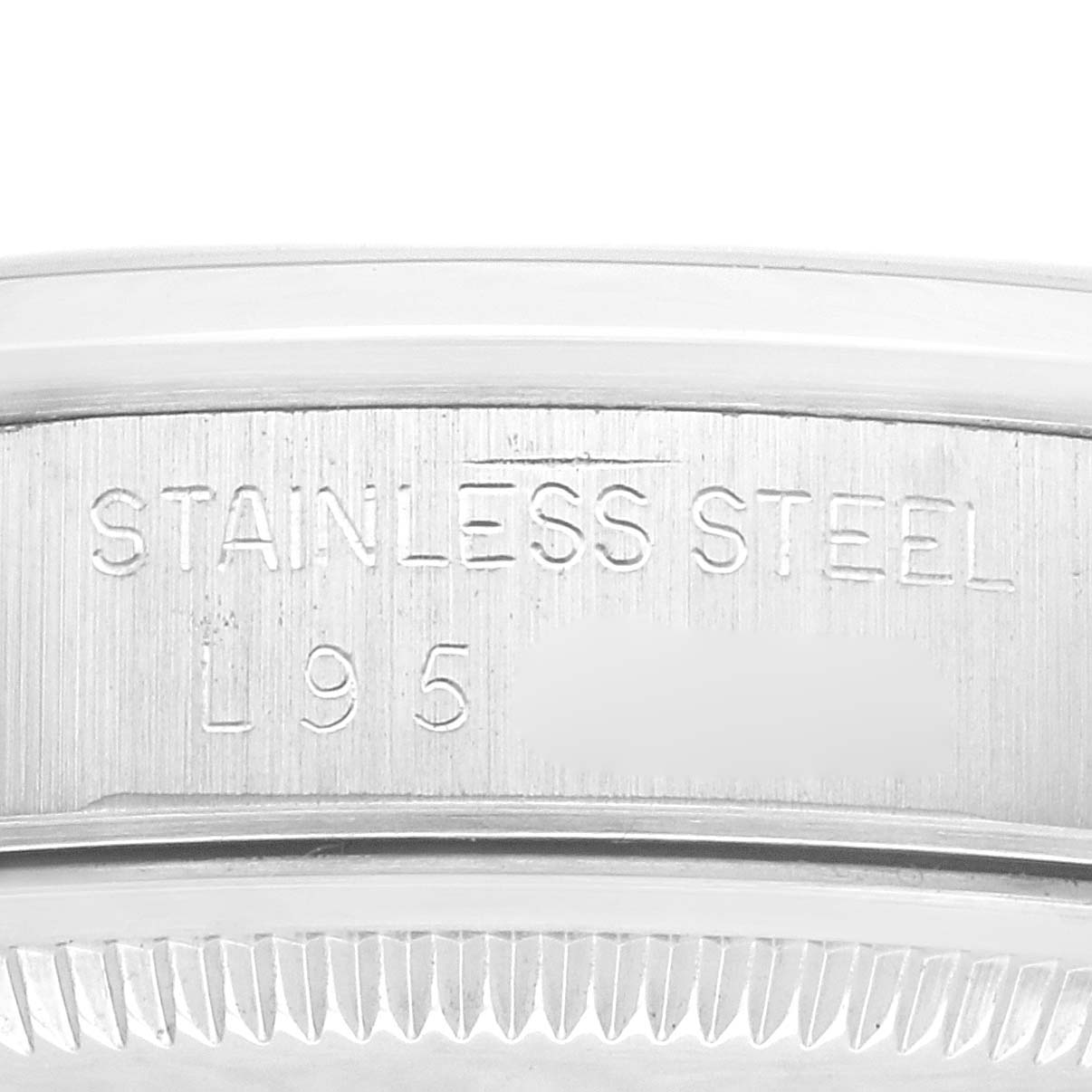 This image shows a close-up of the side engraving and fluted bezel of a Rolex Date 15200 Men
s Stainless Steel Silver Dial 15200 Men
s Stainless Steel Silver Dial model watch.