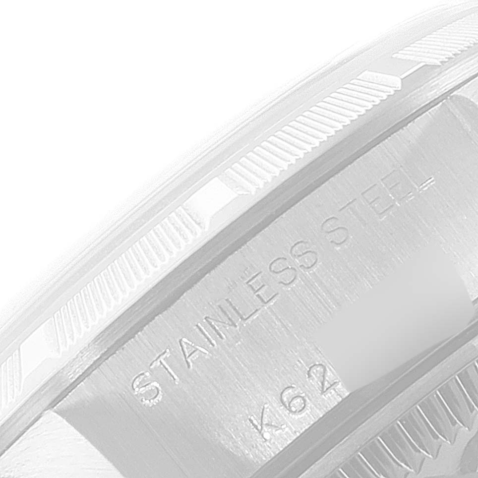 This image shows a close-up of the side of a Rolex Date 79190 Women's Stainless Steel White Dial 79190 Women's Stainless Steel White Dial model, highlighting the stainless steel case and part of the bezel.