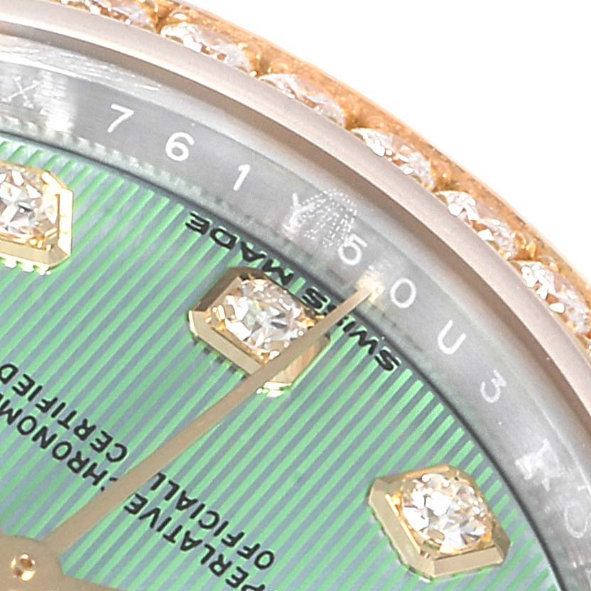 This close-up angle of the Rolex Datejust 279383 Women's Steel and Gold (two tone) Green Dial 279383 Women's Steel and Gold (two tone) Green Dial model shows the upper right part of the dial, including diamond hour markers and part of the bezel.