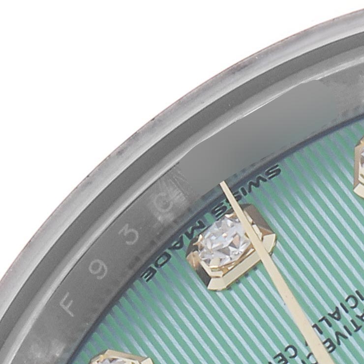 The image shows a close-up angle of the dial on a Rolex Datejust 279173 Women's Steel and Gold (two tone) Green Dial 279173 Women's Steel and Gold (two tone) Green Dial, highlighting the index, diamond marker, and text details.