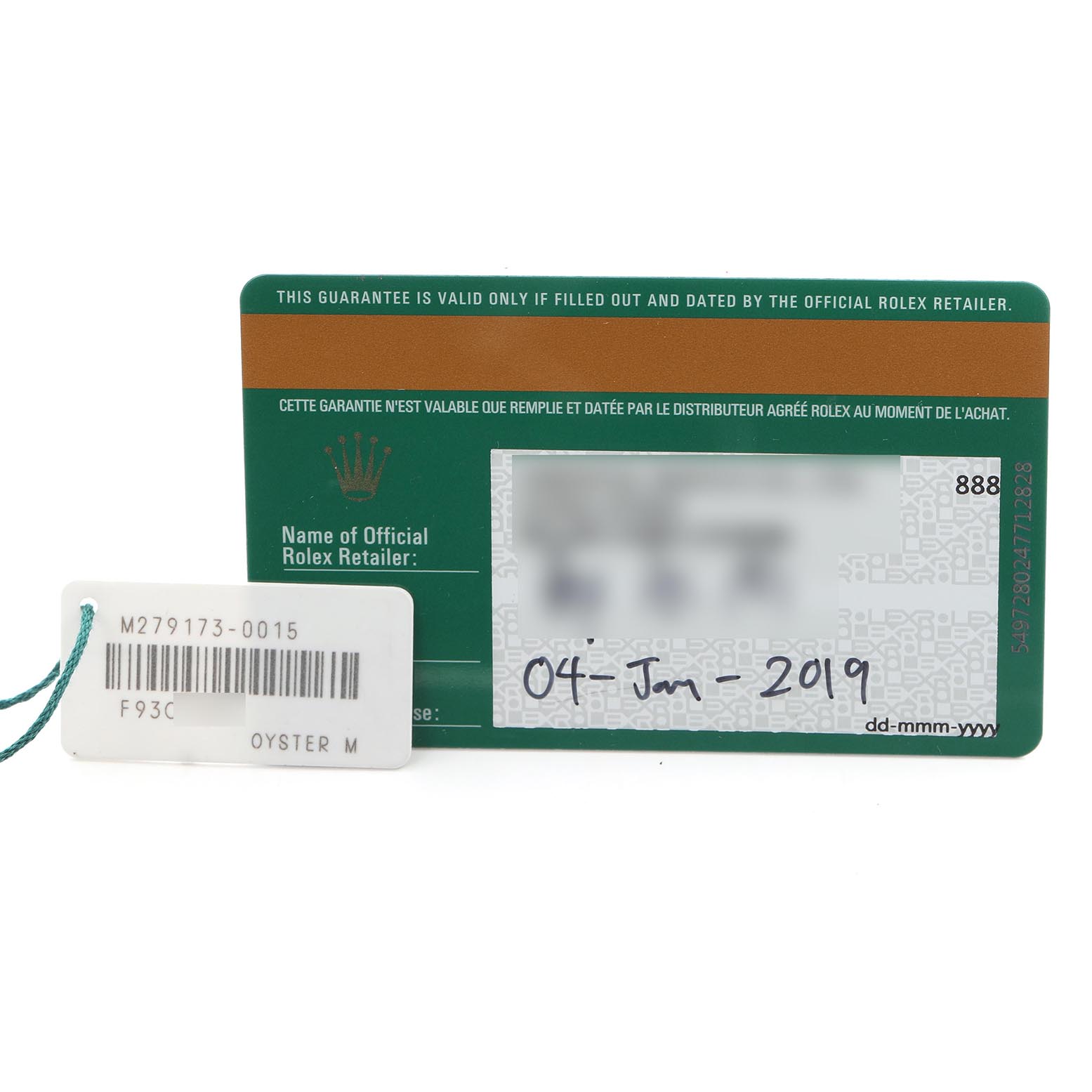 The image shows a Rolex Datejust 279173 Women's Steel and Gold (two tone) Green Dial 279173 Women's Steel and Gold (two tone) Green Dial model warranty card and a retail tag with a barcode and reference number.