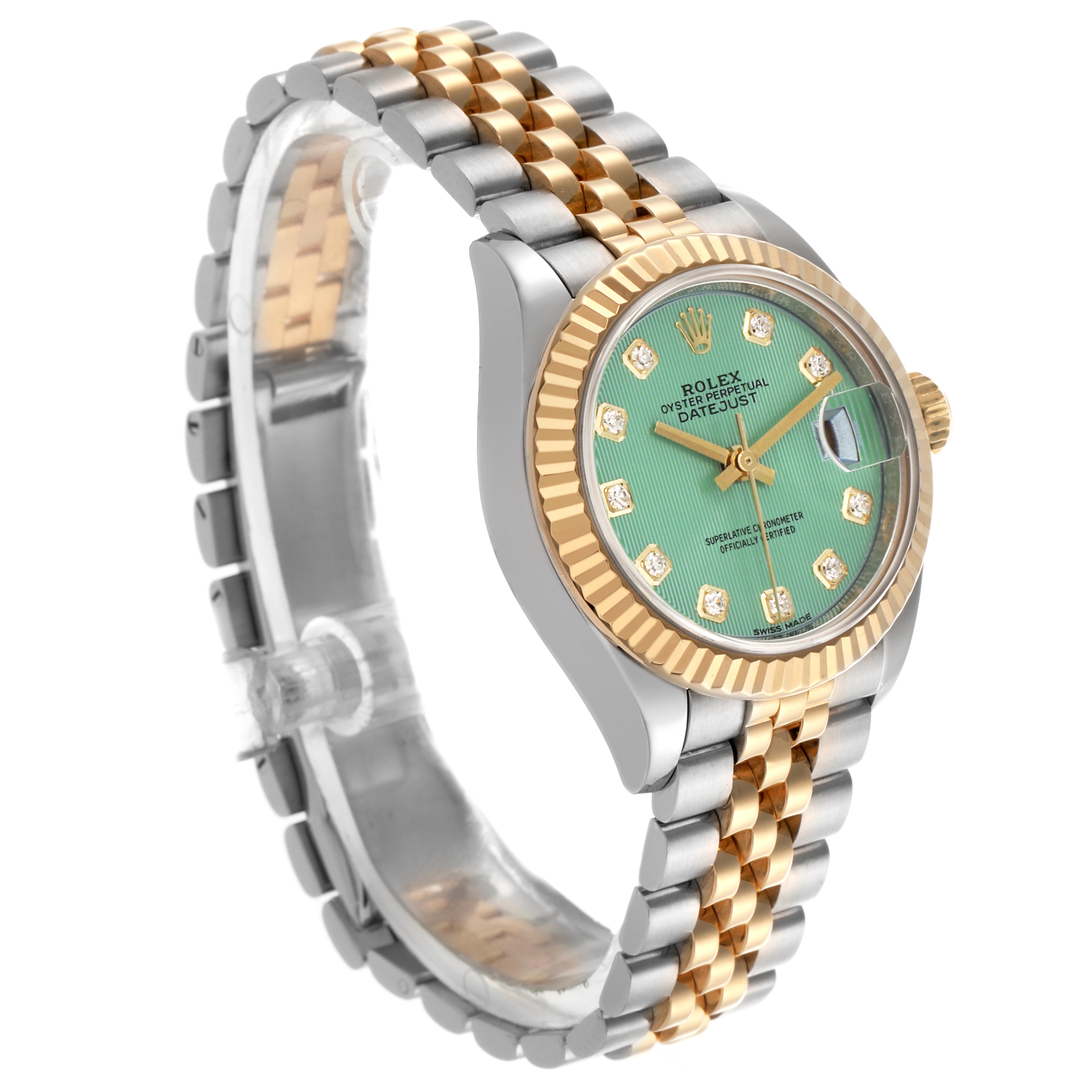 The Rolex Datejust 279173 Women's Steel and Gold (two tone) Green Dial 279173 Women's Steel and Gold (two tone) Green Dial watch is shown at a three-quarter angle, highlighting the green dial, two-tone bracelet, and fluted bezel.