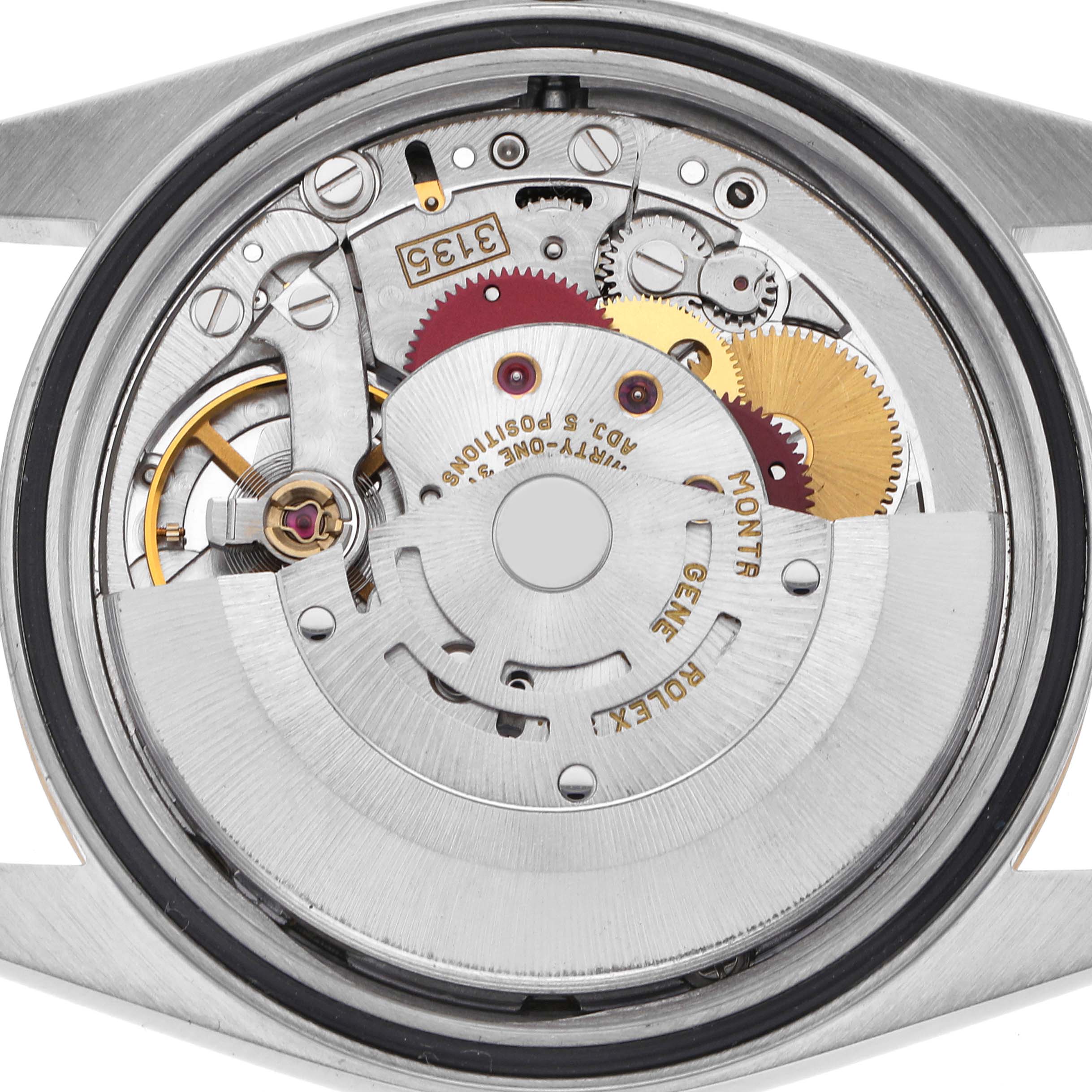 The image shows the movement of a Rolex Datejust 16233 Men
s Steel and Gold (two tone) Champagne Dial 16233 Men
s Steel and Gold (two tone) Champagne Dial watch from a back view, highlighting its intricate mechanical components.