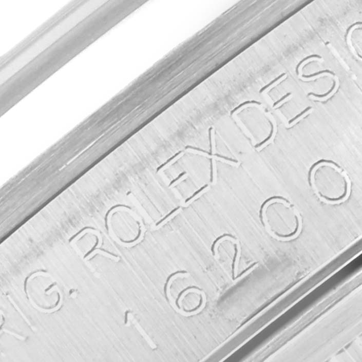 This image shows an extreme close-up of the engraved design number on the inner bezel of a Rolex Datejust 16200 Men's Stainless Steel Black Dial 16200 Men's Stainless Steel Black Dial watch.