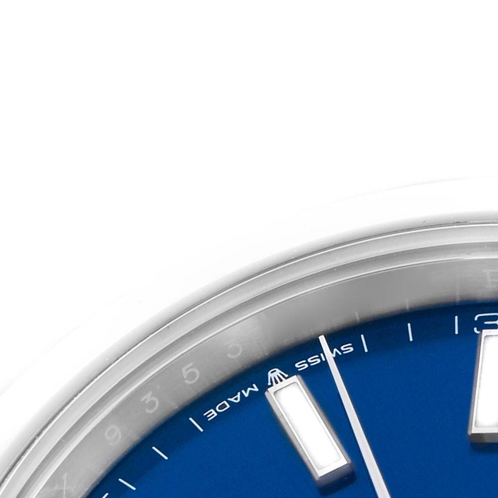 The image shows a close-up of the dial and bezel of a Rolex Datejust 41 126300 Men
s Stainless Steel Blue Dial 126300 Men
s Stainless Steel Blue Dial, highlighting the hour markers and a portion of the blue face.