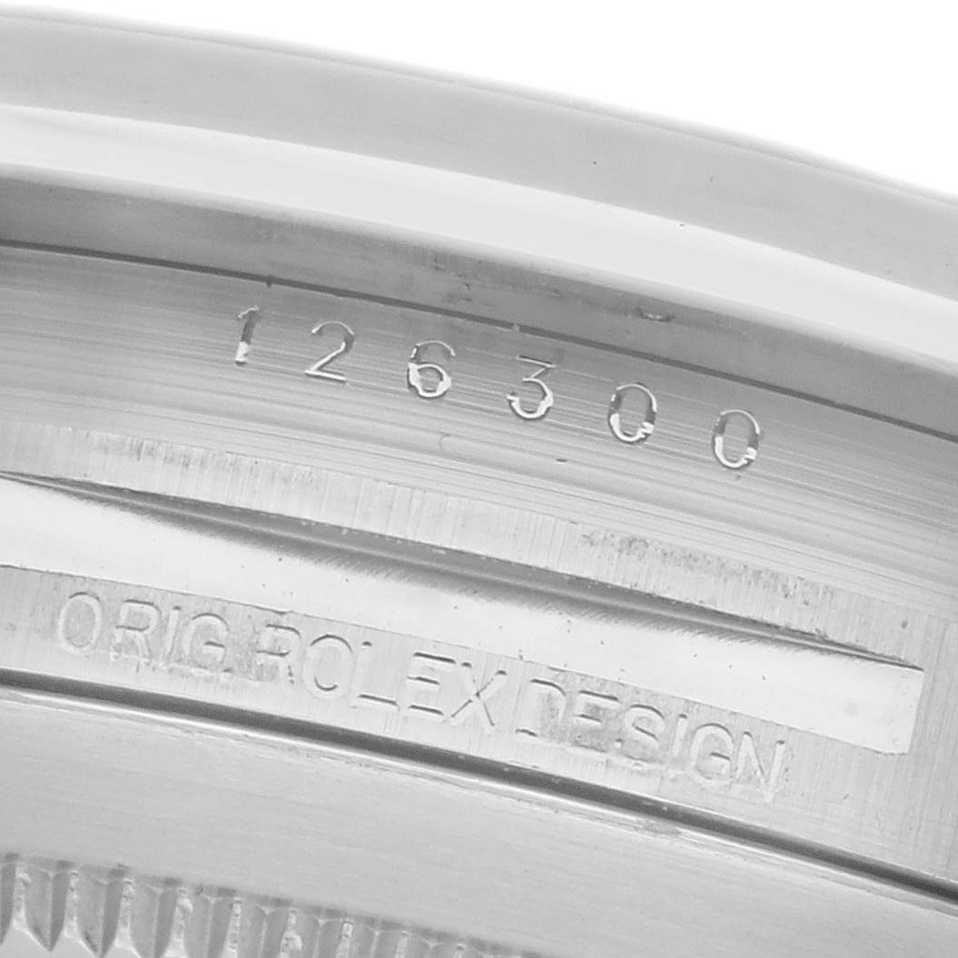 The image shows a close-up of the engraved case back edge of a Rolex Datejust 41 126300 Men
s Stainless Steel Blue Dial 126300 Men
s Stainless Steel Blue Dial, featuring its model number and branding.