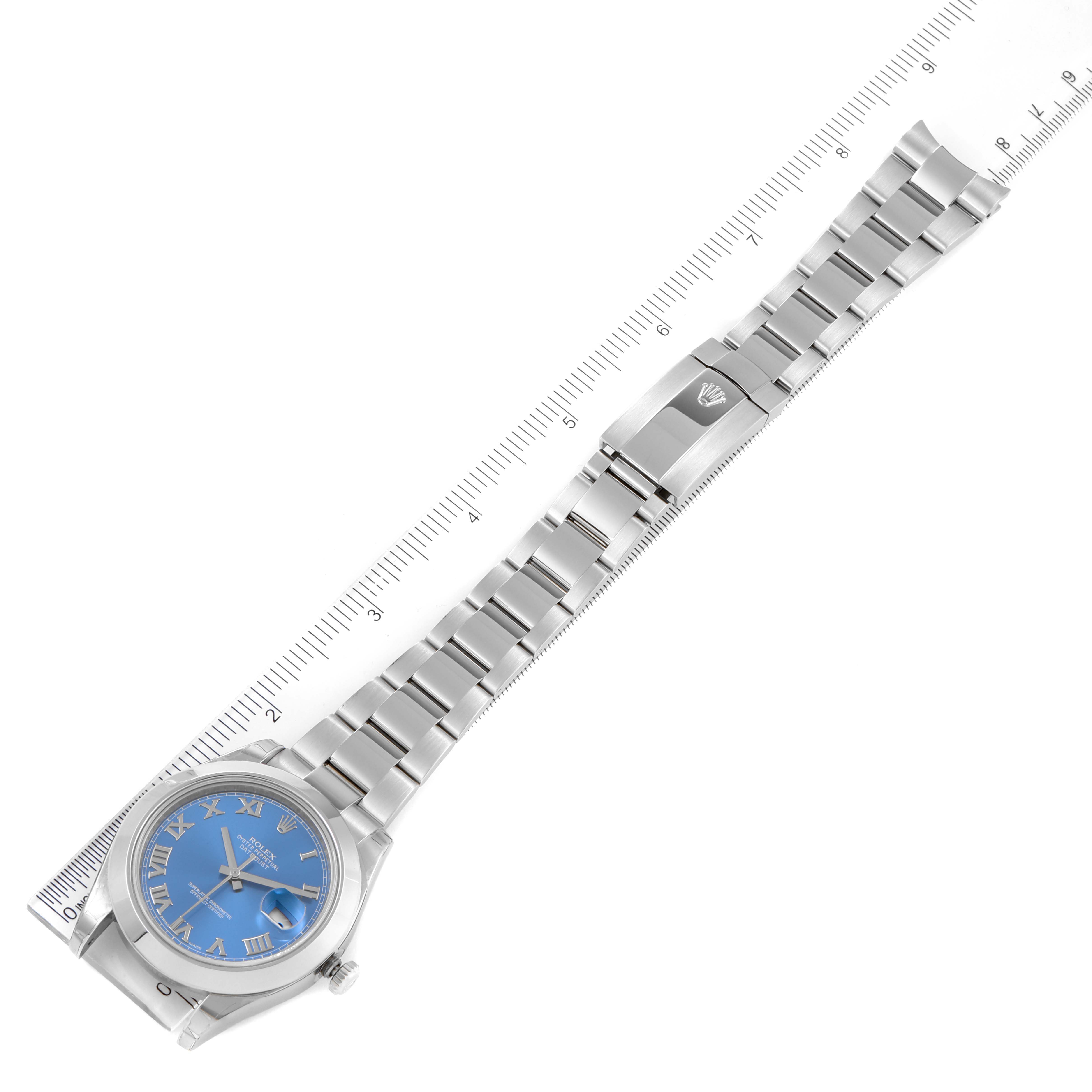 The Rolex Datejust 41 126300 Men's Stainless Steel Blue Dial 126300 Men's Stainless Steel Blue Dial watch is shown lying flat with its band fully extended alongside a measuring ruler.