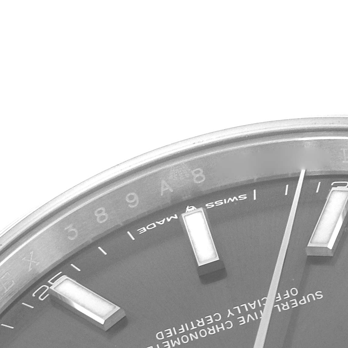 This image shows a close-up of the dial of a Rolex Datejust 41 126300 Men
s Stainless Steel Grey Dial 126300 Men
s Stainless Steel Grey Dial watch, displaying part of its index markers and text.