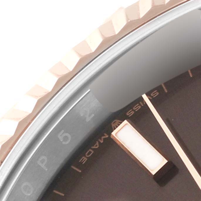 The image shows a close-up of the bezel, dial, and part of the hour marker of the Rolex Datejust 41 126331 Men
s Steel and Gold (two tone) Brown Dial 126331 Men
s Steel and Gold (two tone) Brown Dial watch.