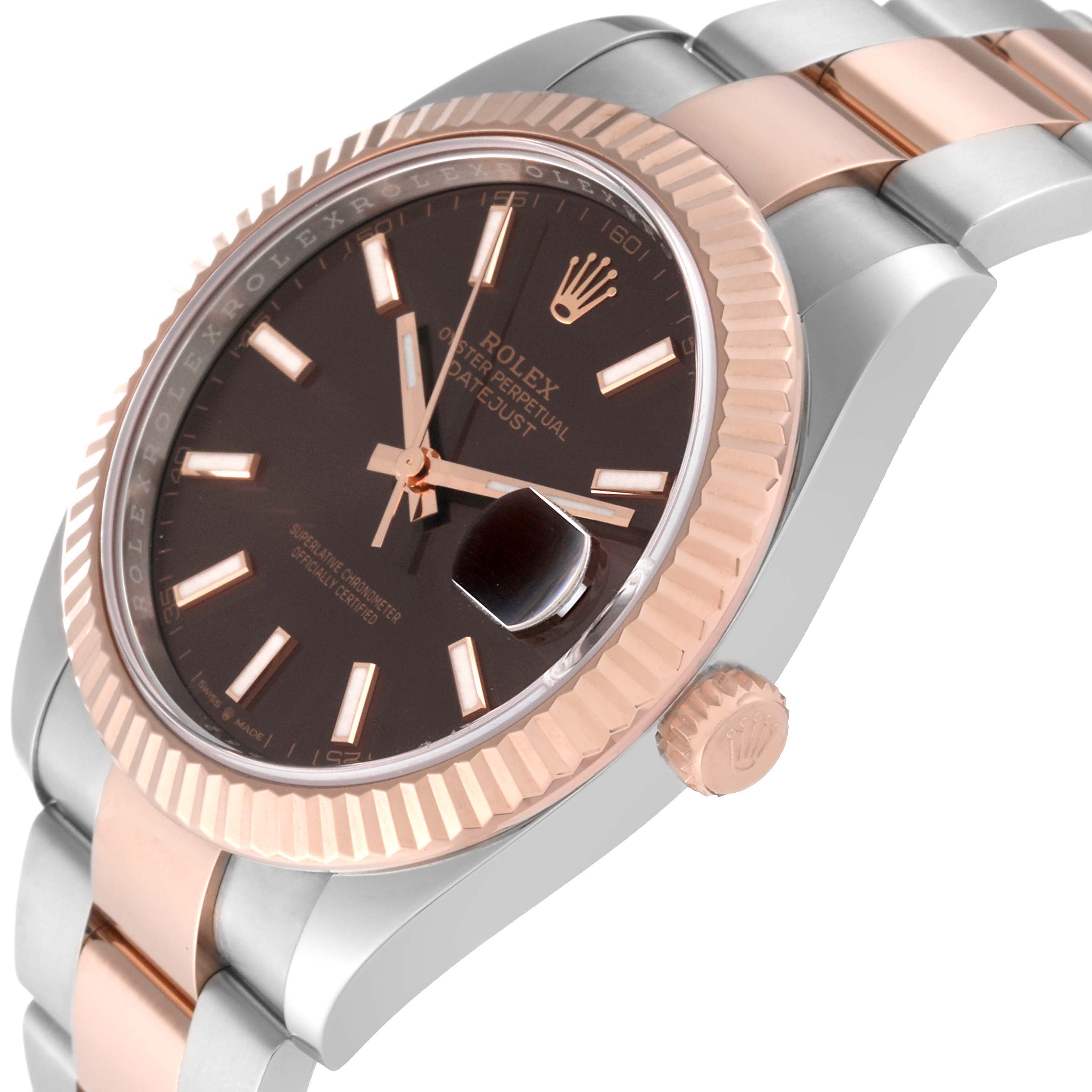 The image shows a side angle of the Rolex Datejust 41 126331 Men
s Steel and Gold (two tone) Brown Dial 126331 Men
s Steel and Gold (two tone) Brown Dial watch, featuring the dial, bezel, crown, and part of the bracelet.