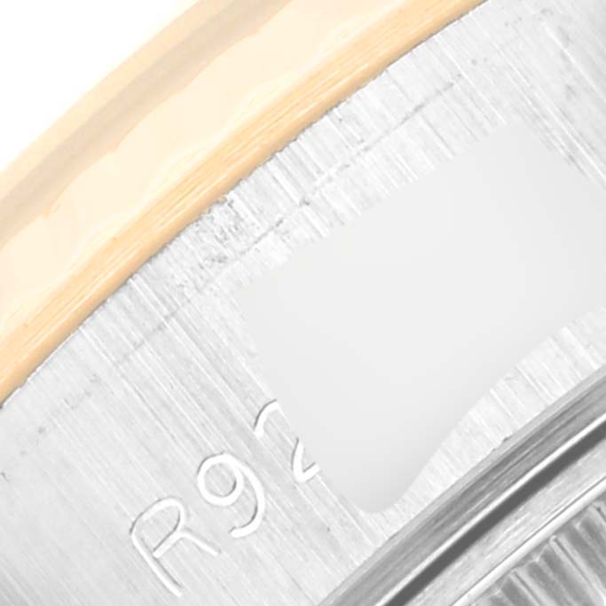 The image shows a close-up of the side of the bezel and part of the case back of a Rolex Datejust 69173 Women
s Steel and Gold (two tone) Champagne Dial 69173 Women
s Steel and Gold (two tone) Champagne Dial watch.