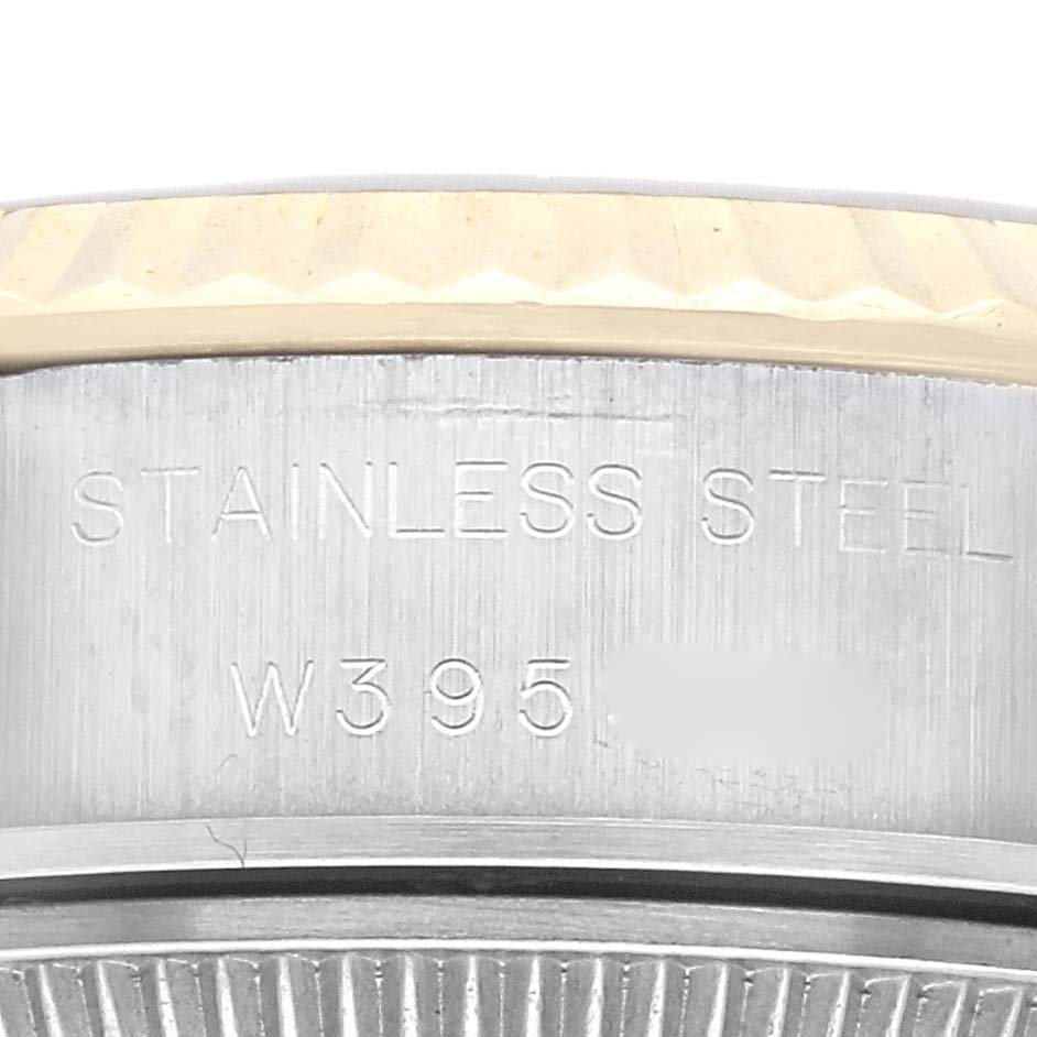 Close-up angle shows the side of the Rolex Datejust 69173G Women's Steel and Gold (two tone) Champagne Dial 69173G Women's Steel and Gold (two tone) Champagne Dial watch case with "STAINLESS STEEL" engraving.