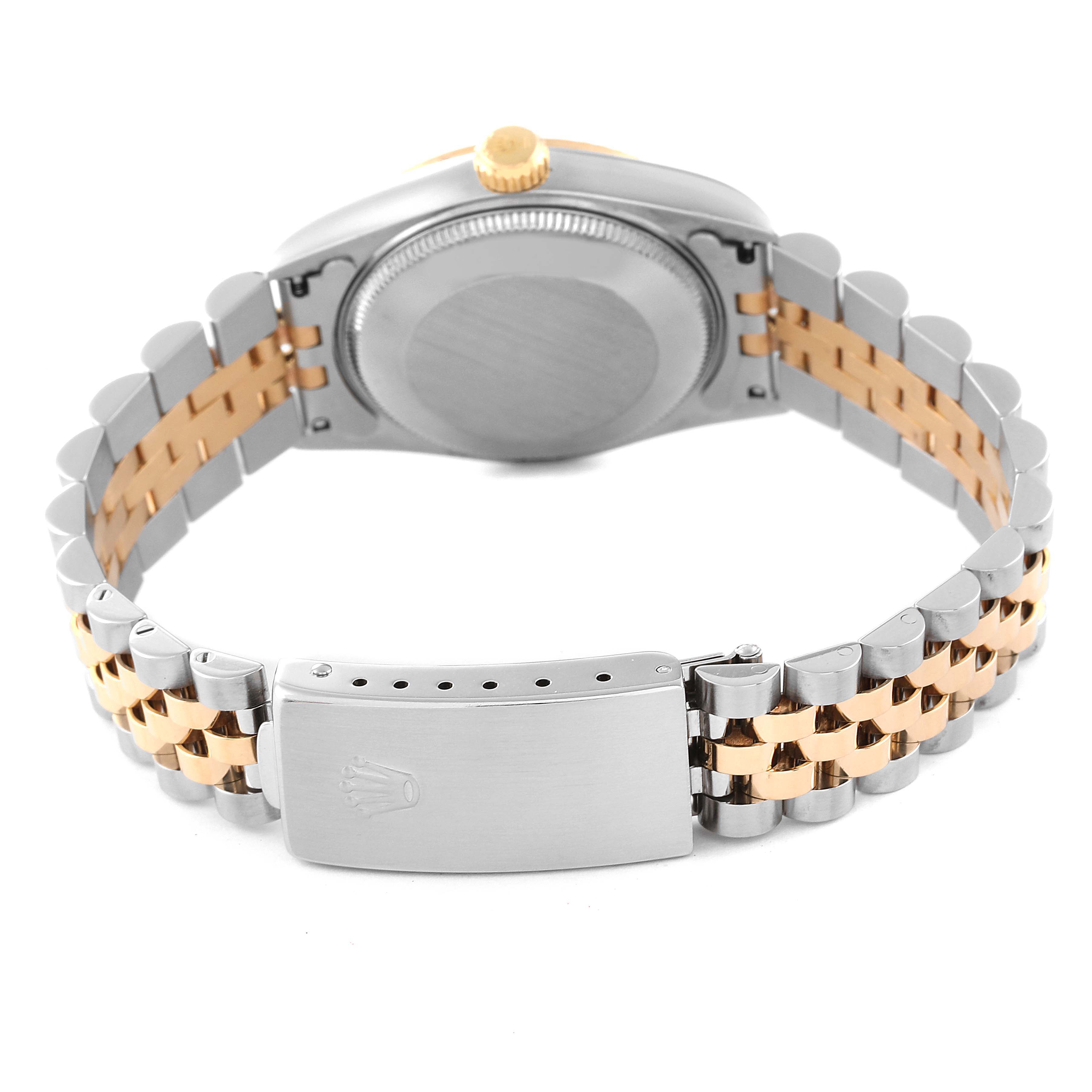 The image shows the back view of a Rolex Mid-Size 68273 Women's Steel and Gold (two tone) Blue Dial 68273 Women's Steel and Gold (two tone) Blue Dial watch with its case back, crown, and bi-metal bracelet with the clasp visible.