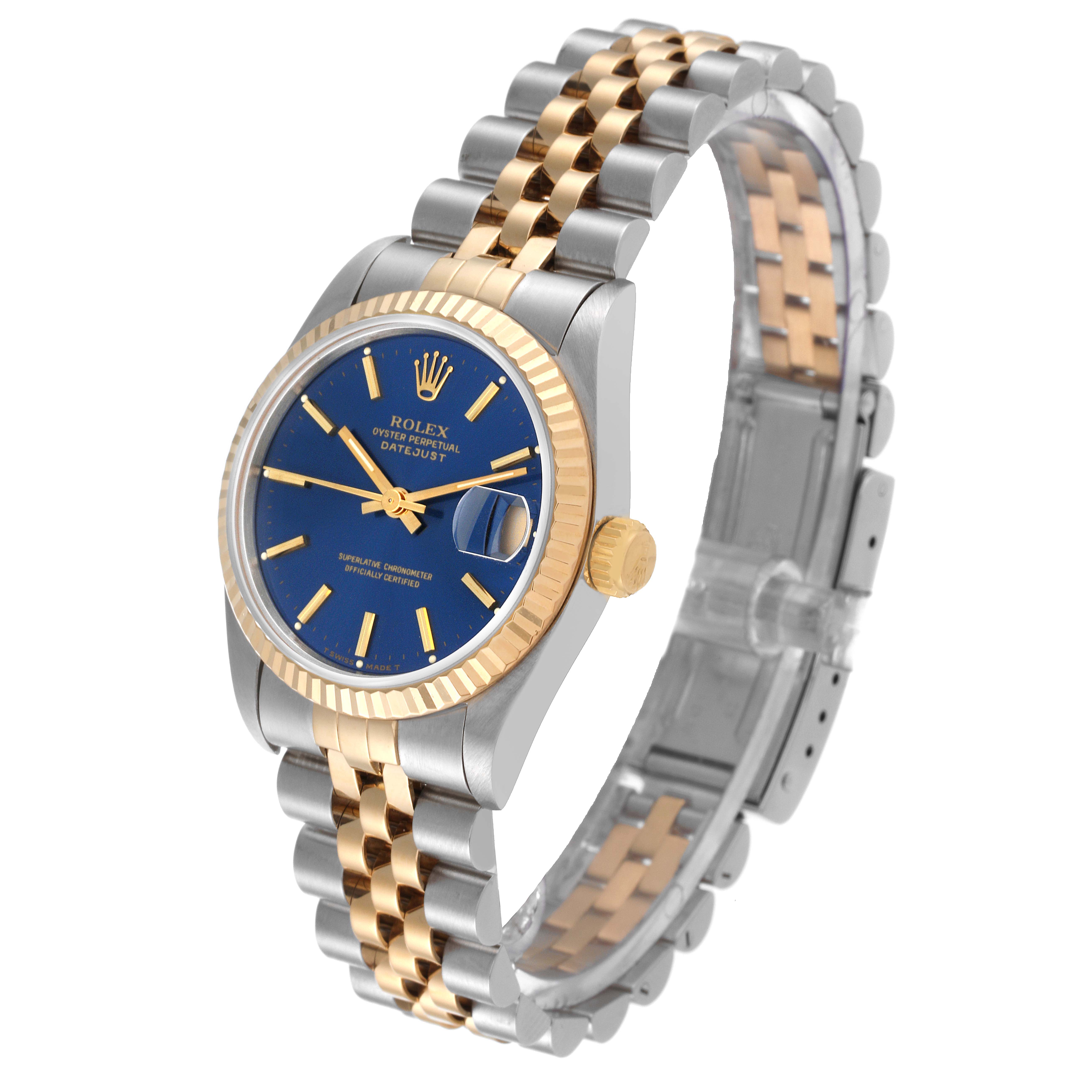 This image shows a Rolex Mid-Size 68273 Women's Steel and Gold (two tone) Blue Dial 68273 Women's Steel and Gold (two tone) Blue Dial Datejust watch at an angled view, highlighting its blue dial, gold fluted bezel, and two-tone Jubilee bracelet.