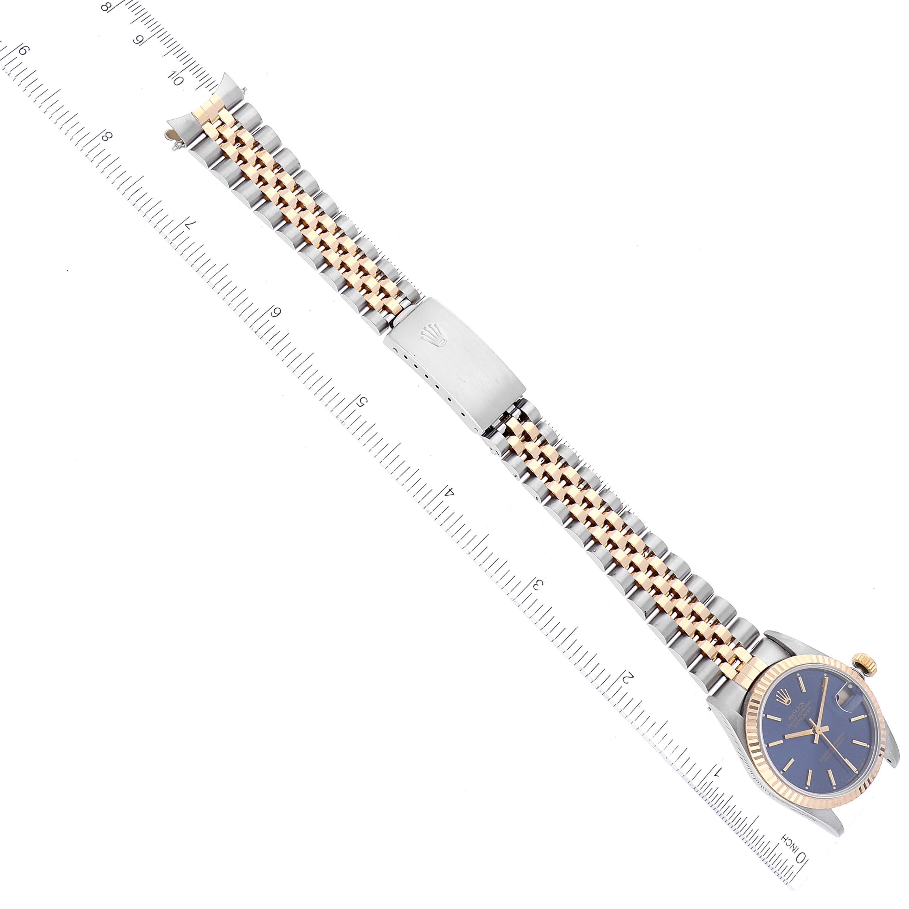 The image shows a top-down view of a Rolex Mid-Size 68273 Women's Steel and Gold (two tone) Blue Dial 68273 Women's Steel and Gold (two tone) Blue Dial model watch, illustrating the band and part of the watch face.