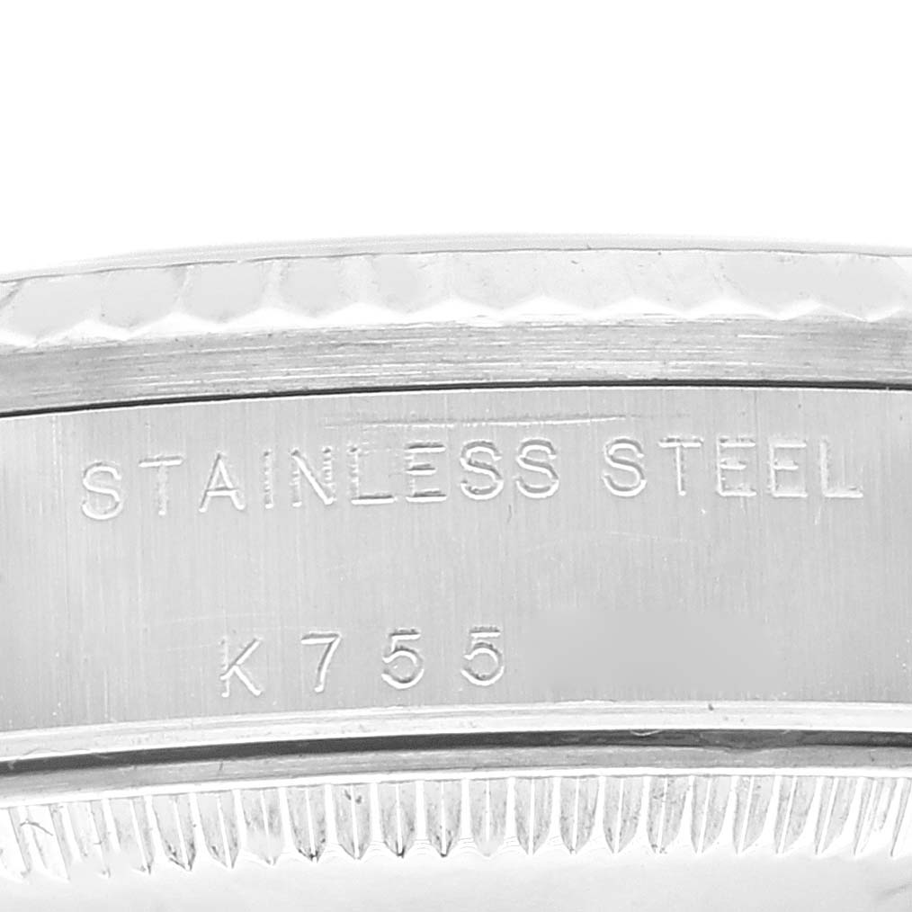 This close-up image shows the side casing of the Rolex Mid-Size 78274 Women's Stainless Steel Black Dial 78274 Women's Stainless Steel Black Dial model, featuring "Stainless Steel" and a serial number.