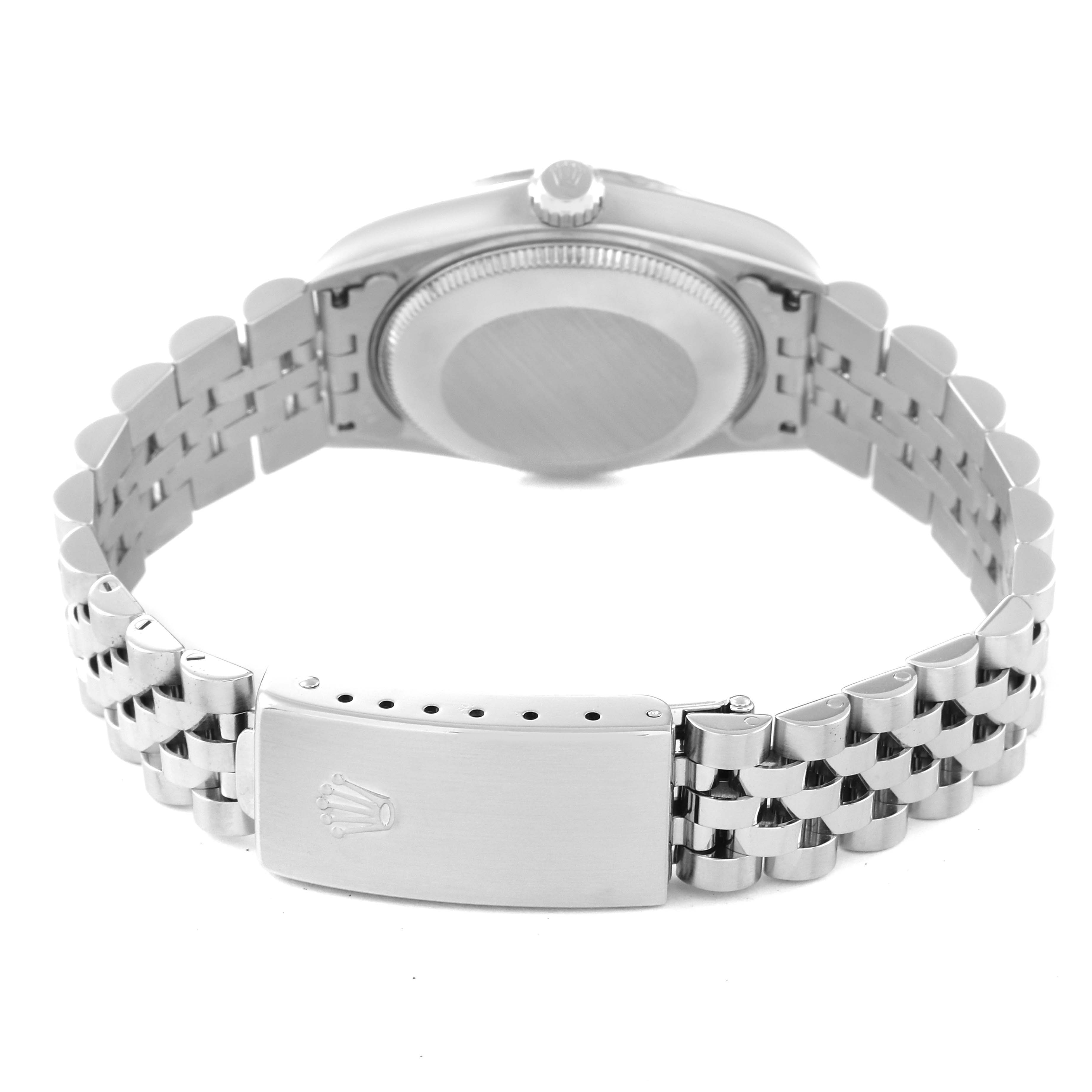 The image shows the back of a Mid-Size Rolex watch, highlighting its bracelet, case back, and clasp with the Rolex logo.