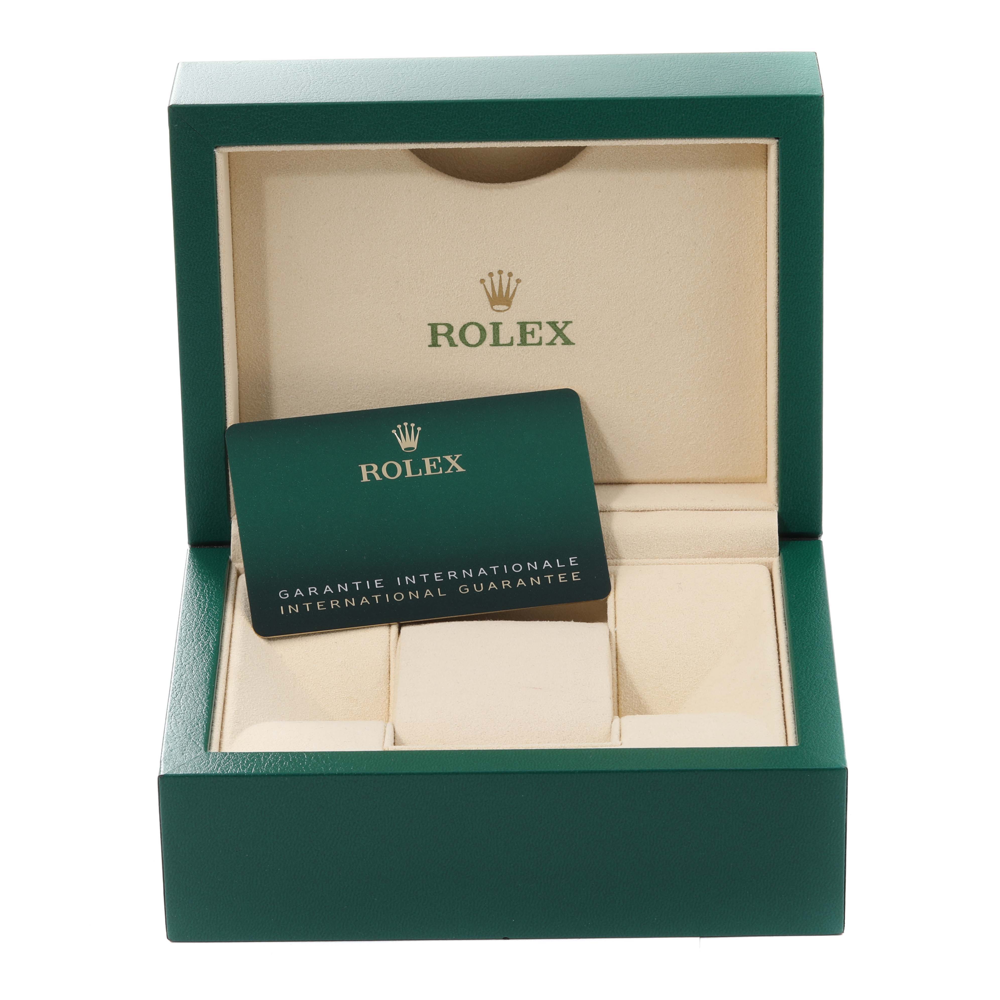 This image shows a Rolex Mid-Size 278273 Women's Steel and Gold (two tone) Green Dial 278273 Women's Steel and Gold (two tone) Green Dial model watch box and international guarantee card from a frontal angle.