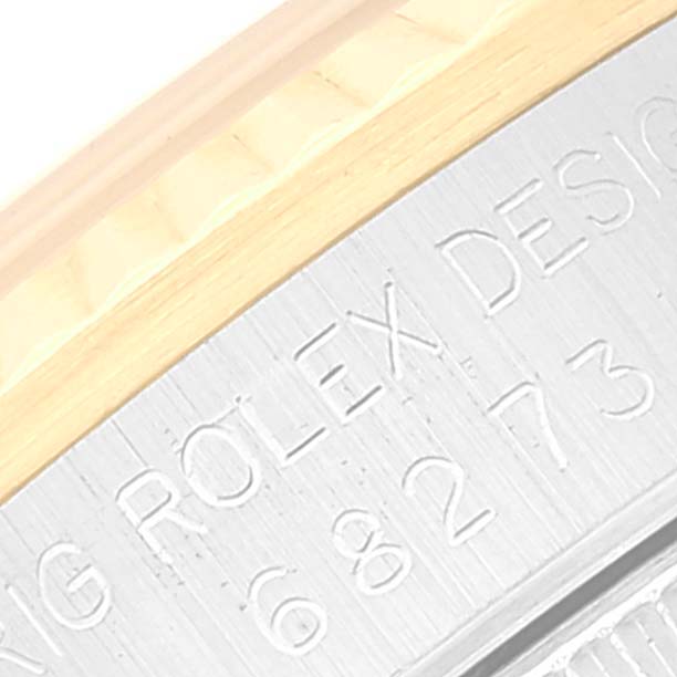 This image shows a close-up of the side engraving of a Mid-Size Rolex watch.