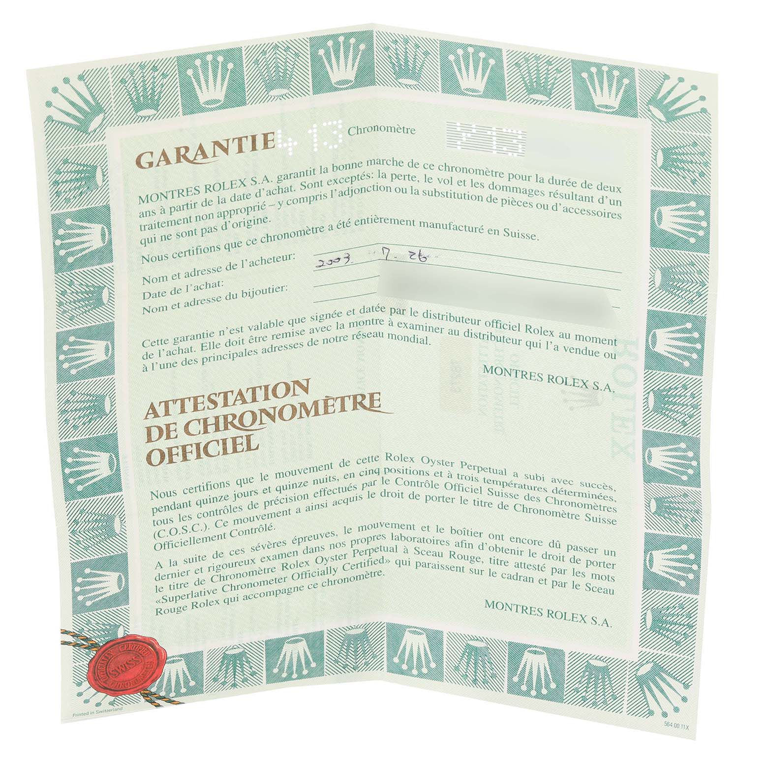 The image shows a warranty certificate for the Mid-Size Rolex watch, featuring brand markings and details of the watch purchase.