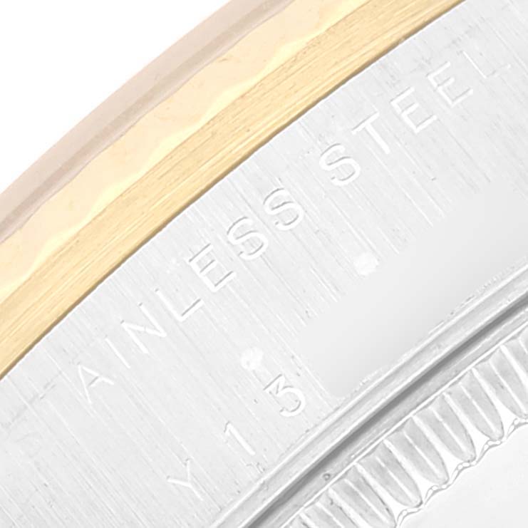 The image shows a close-up of the case back of a Rolex Mid-Size 78273 Women
s Steel and Gold (two tone) White Dial 78273 Women
s Steel and Gold (two tone) White Dial watch, highlighting its stainless steel material.