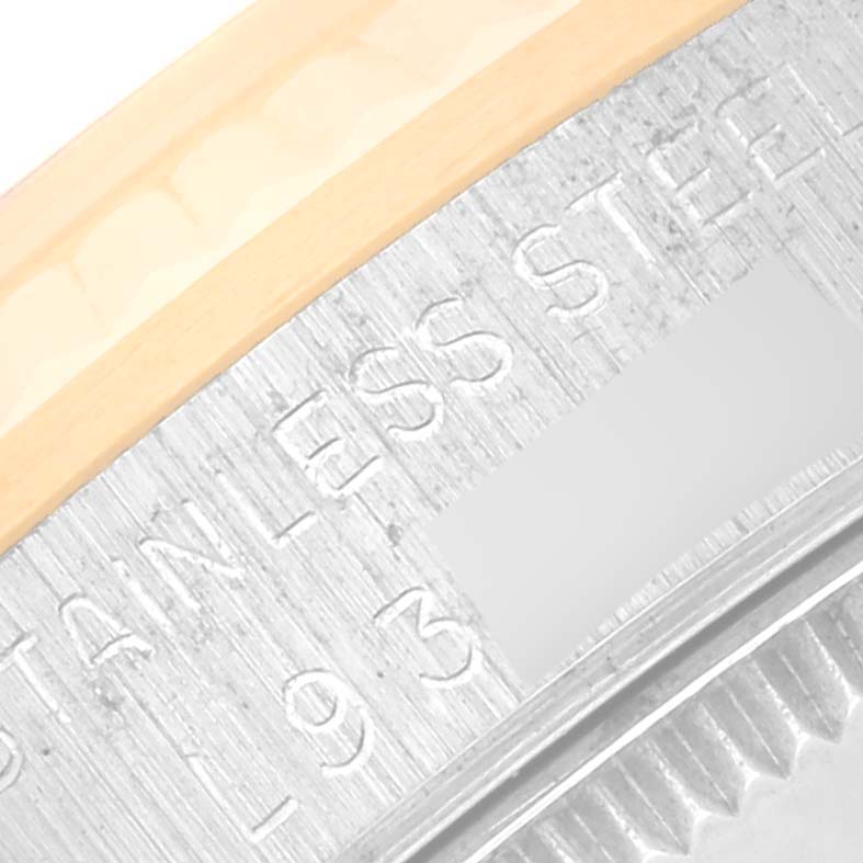 This image shows a close-up of the case engraving and part of the bezel of a Rolex Mid-Size 68273 Women's Steel and Gold (two tone) Champagne Dial 68273 Women's Steel and Gold (two tone) Champagne Dial watch.