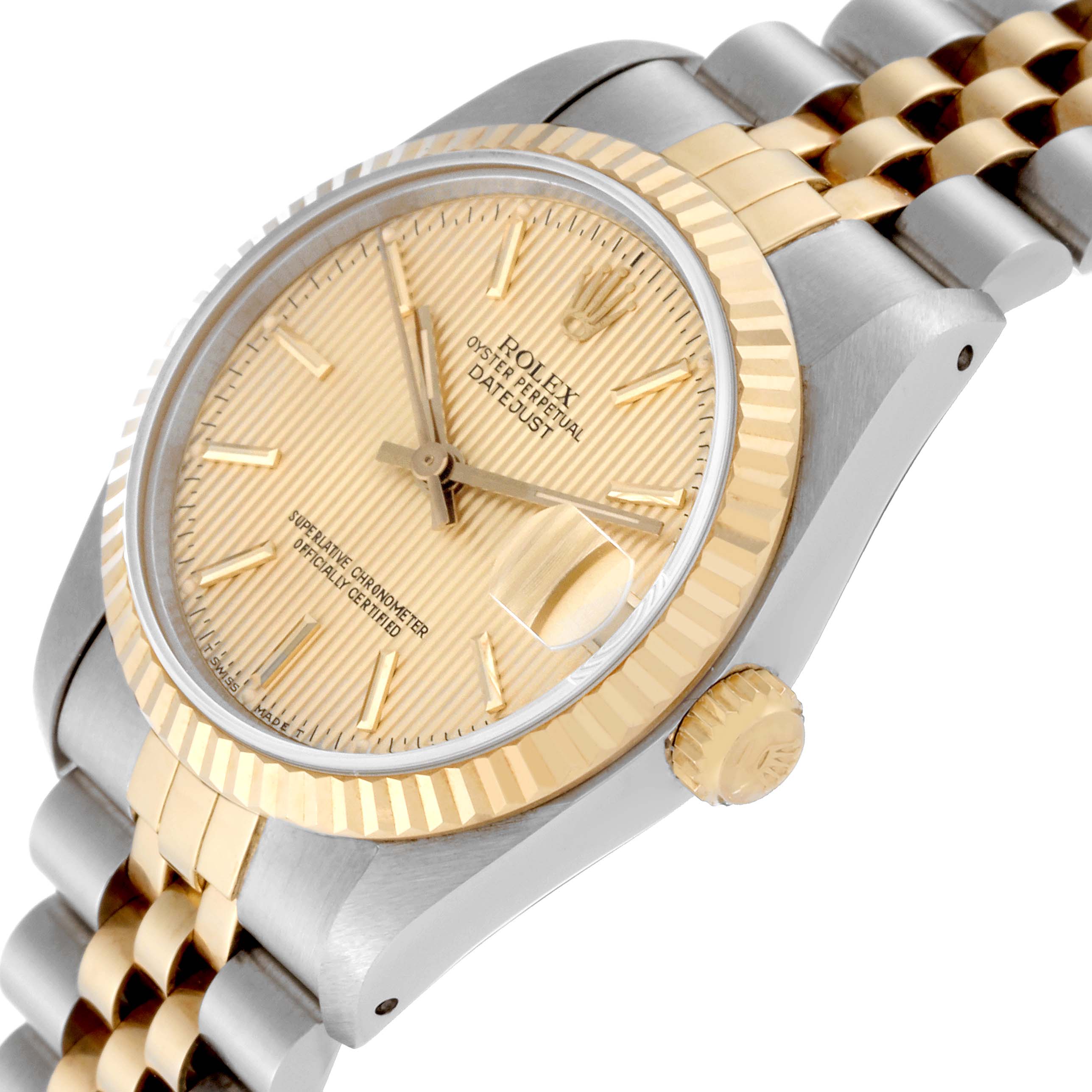 The image shows a close-up side angle of the Rolex Mid-Size 68273 Women's Steel and Gold (two tone) Champagne Dial 68273 Women's Steel and Gold (two tone) Champagne Dial Datejust, highlighting the dial, bezel, and crown.