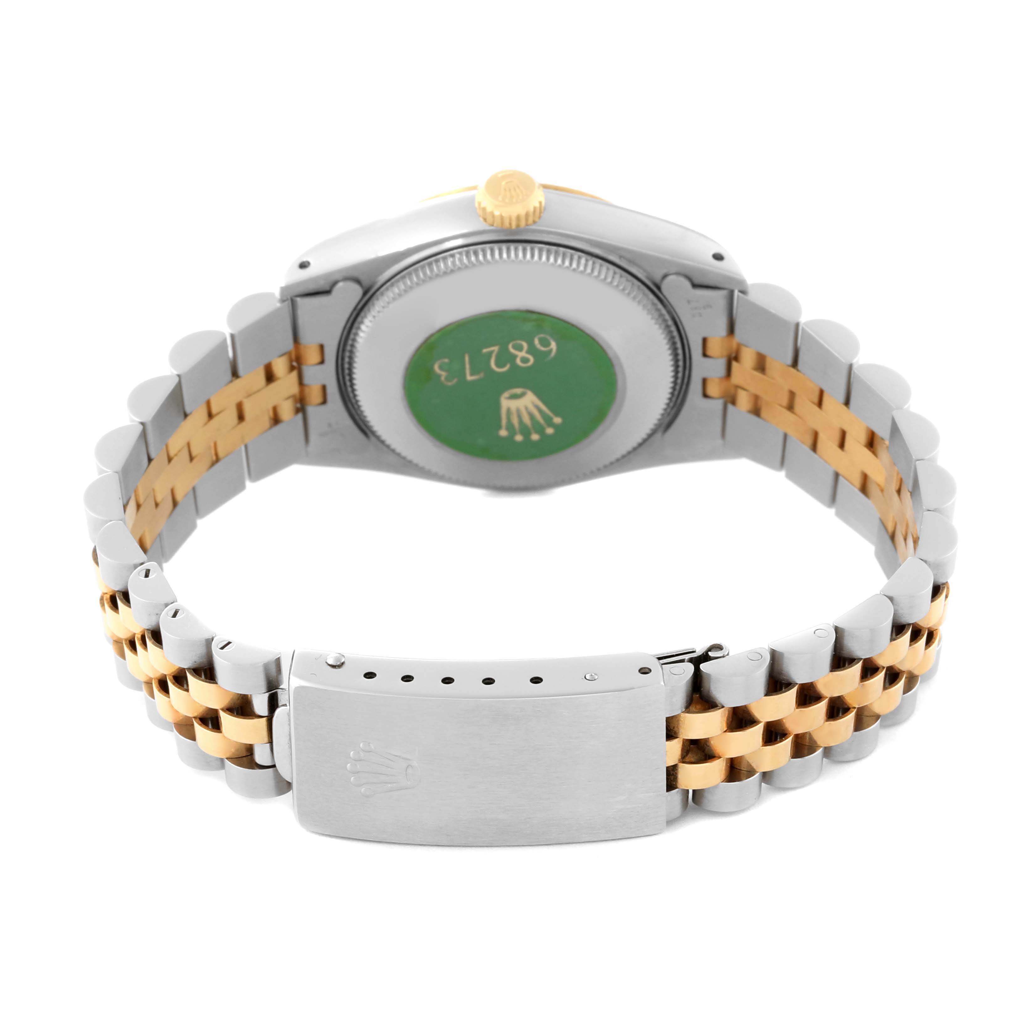 This image shows the back casing, crown, and bracelet clasp of a Rolex Mid-Size 68273 Women's Steel and Gold (two tone) Champagne Dial 68273 Women's Steel and Gold (two tone) Champagne Dial watch.