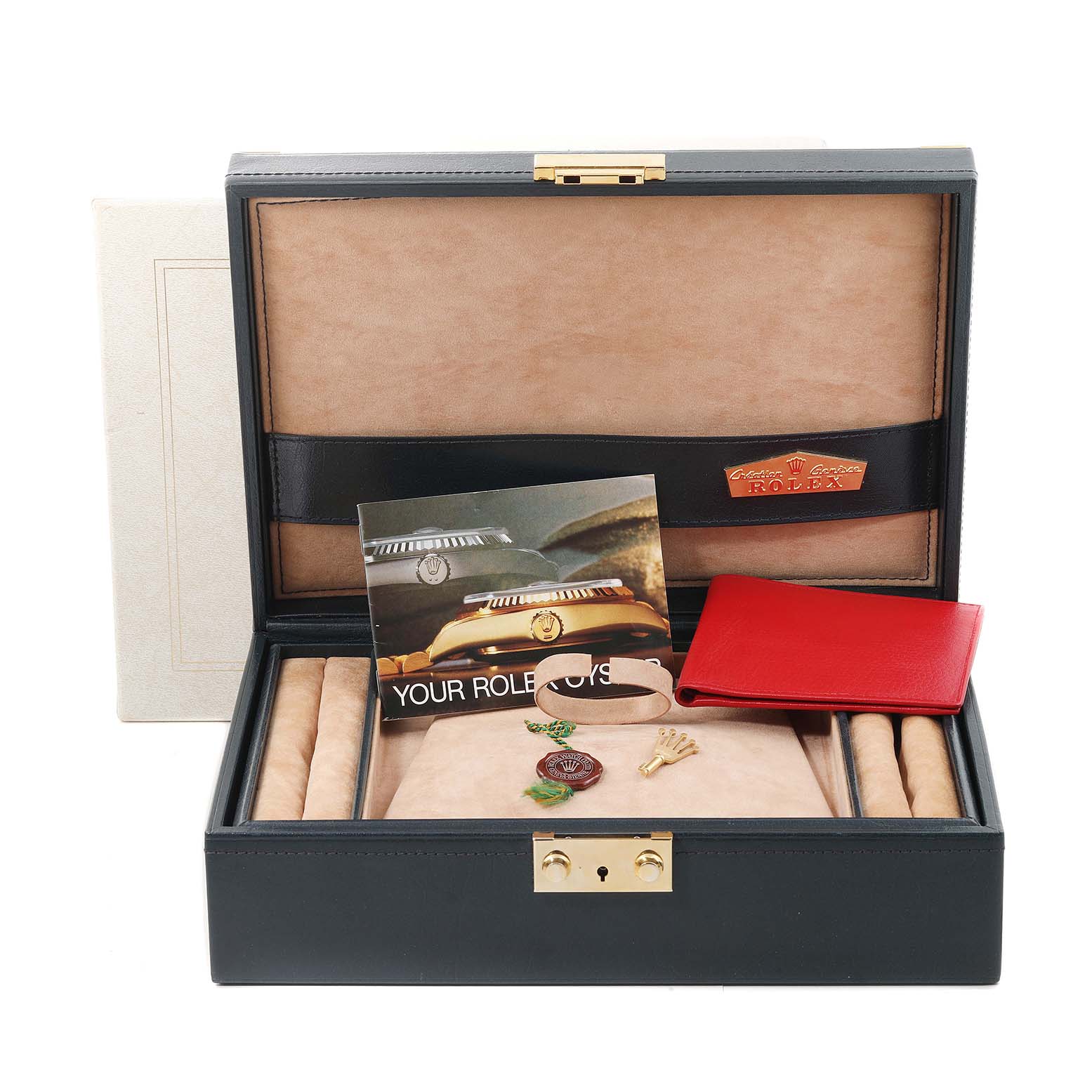 This image shows an open Rolex Mid-Size watch box with accessories including a booklet, tags, a red wallet, and a pin.