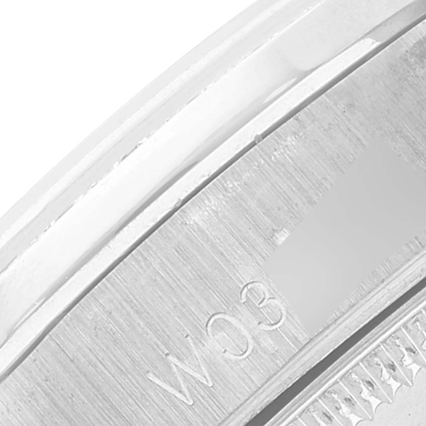 This close-up image shows the engraved details on the side of the case of the Rolex Mid-Size model watch.