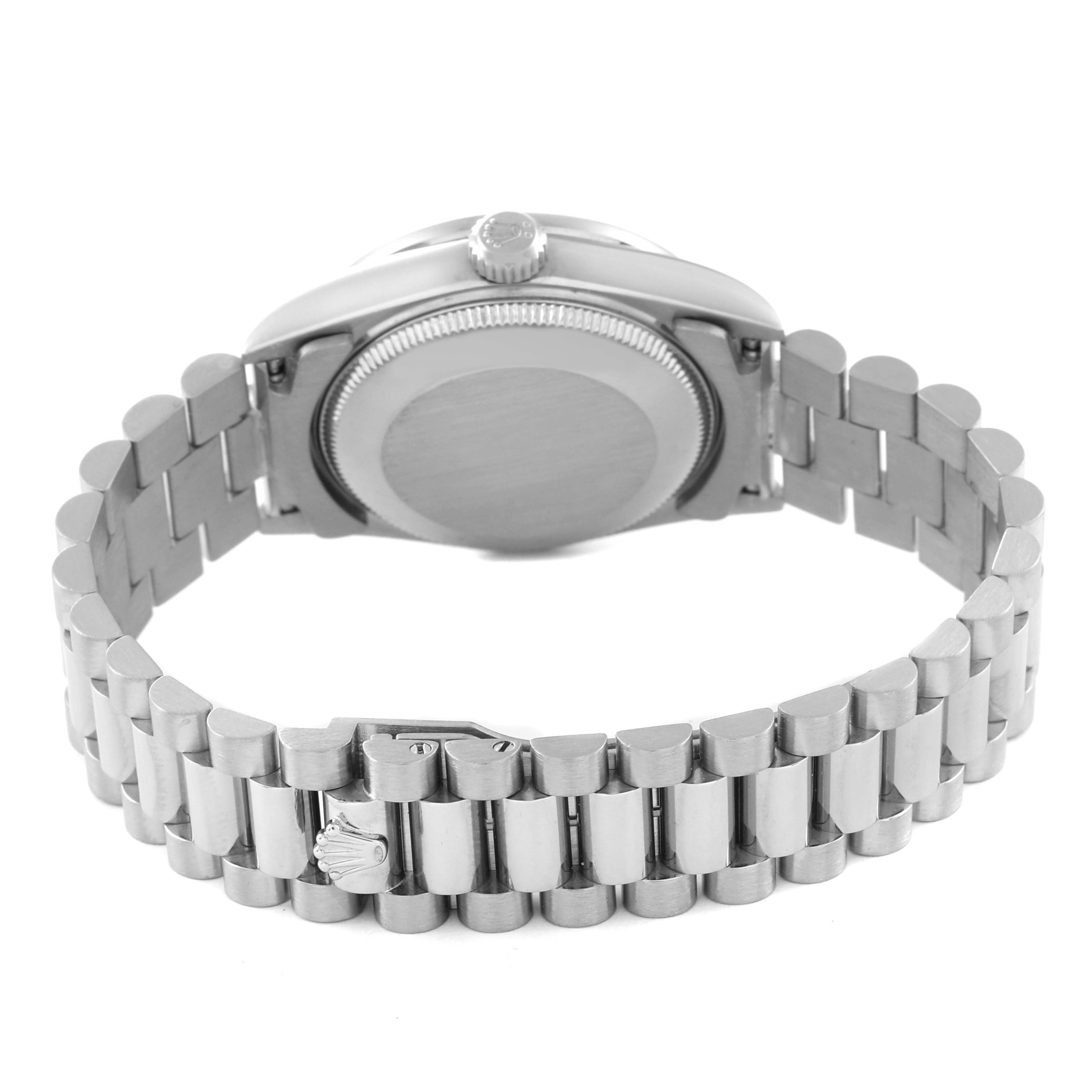 The image shows the back and bracelet of a Mid-Size Rolex watch, highlighting the case back and clasp with Rolex logo.