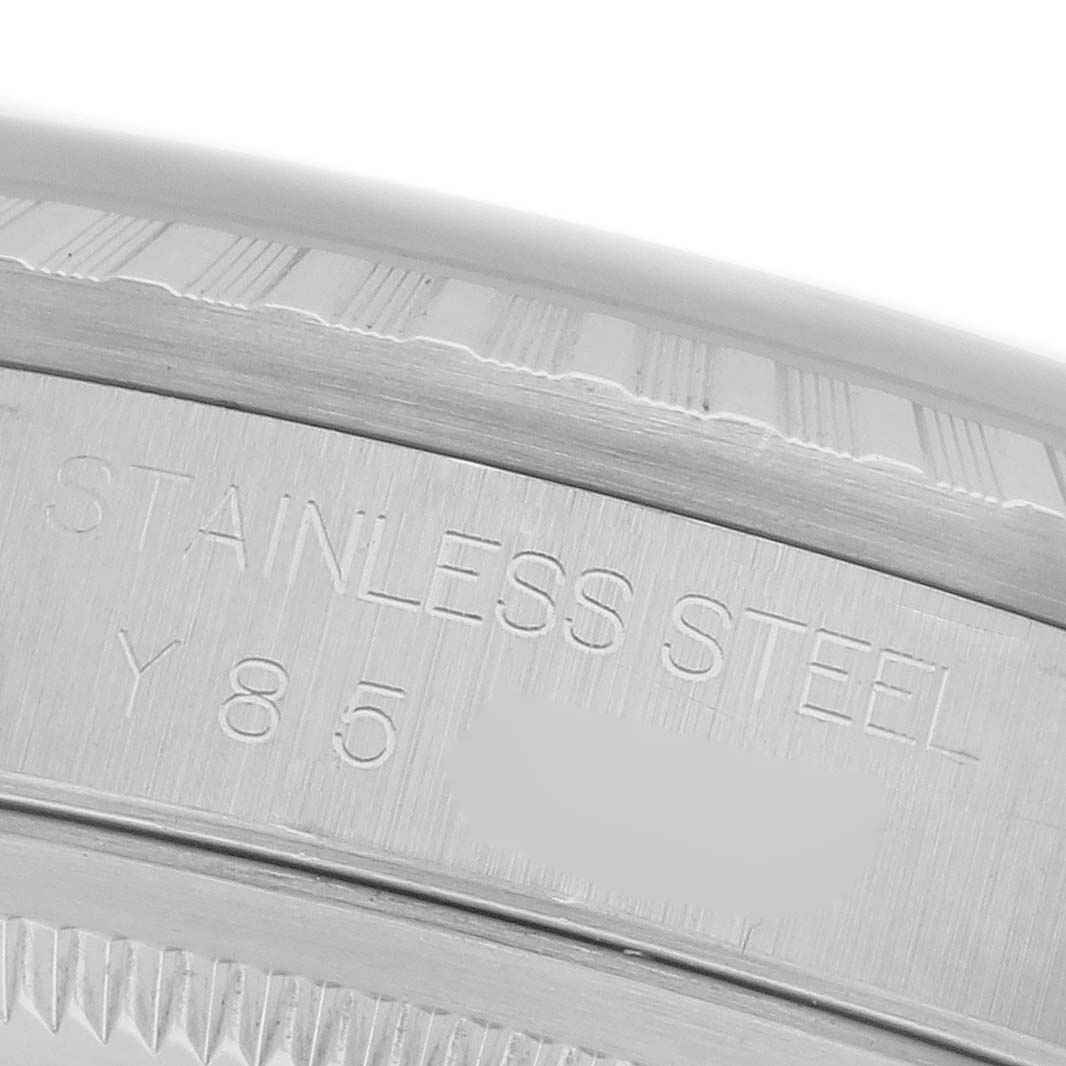 The image shows a close-up of the stainless steel bezel of a Rolex Datejust 16220 Men
s Stainless Steel Silver Dial 16220 Men
s Stainless Steel Silver Dial watch, highlighting detailing and engravings.