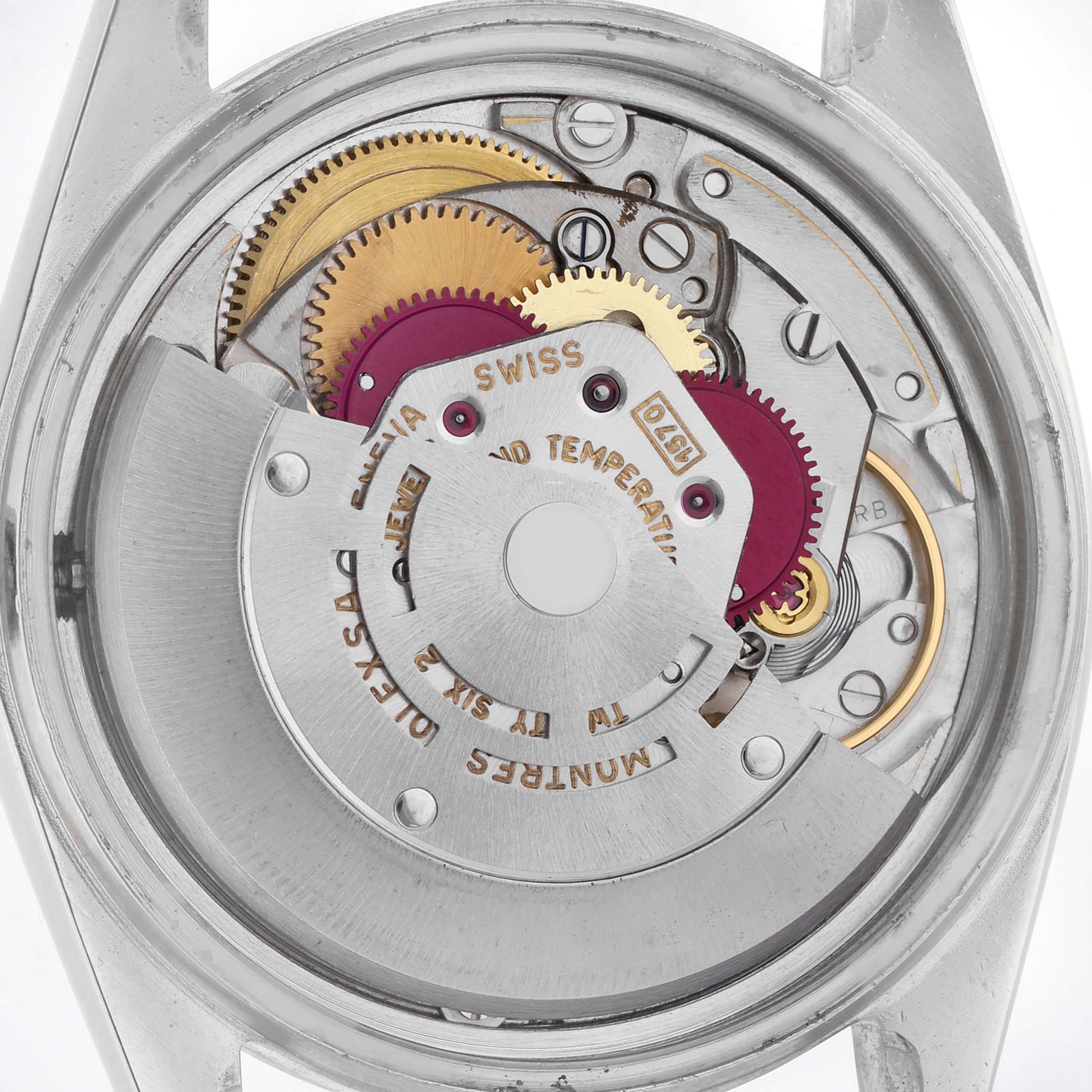 The image shows the movement of a Rolex Datejust 1600 Men
s Stainless Steel Silver Dial 1600 Men
s Stainless Steel Silver Dial watch from the back, revealing gears and intricate components.