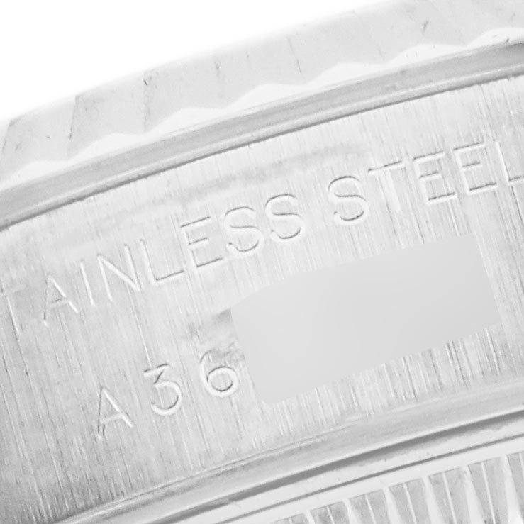 The image shows a close-up of the back case, highlighting "STAINLESS STEEL" on the Rolex Datejust 79174 Women
s Stainless Steel Silver Dial 79174 Women
s Stainless Steel Silver Dial.