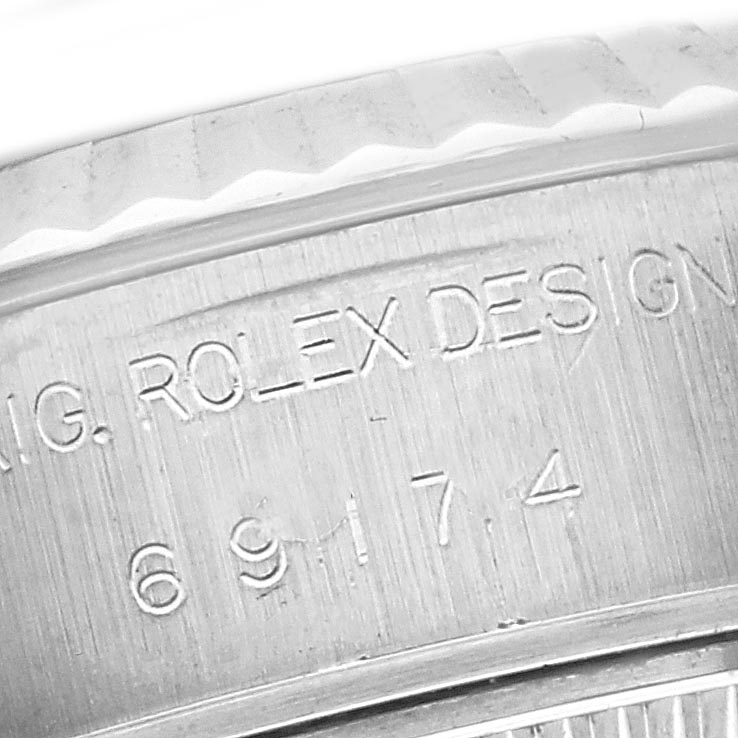 This close-up angle shows the engraved details on the side of a Rolex Datejust 79174 Women
s Stainless Steel Silver Dial 79174 Women
s Stainless Steel Silver Dial watch case.